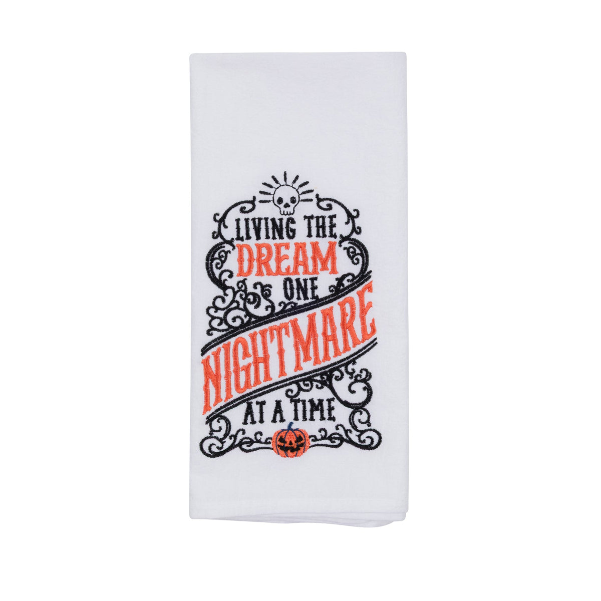 A white fabric kitchen towel featuring a Halloween-themed graphic with the text 'LIVING THE DREAM ONE NIGHTMARE AT A TIME' in black and orange lettering, decorated with a skull, spider, and pumpkin jack-o'-lantern motifs.