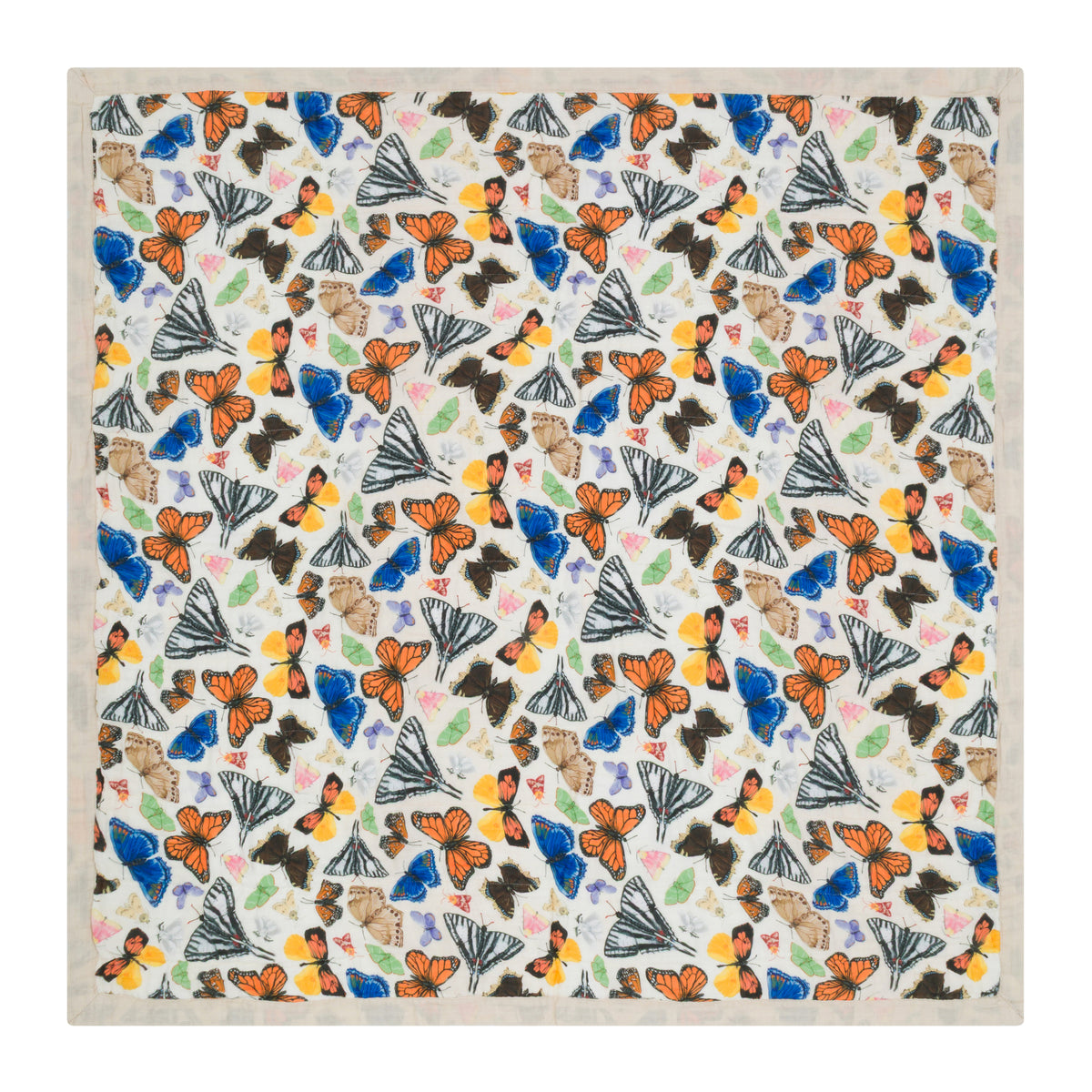 Reversible baby blanket with a colorful butterfly print on one side and a solid beige color on the reverse, on a white background