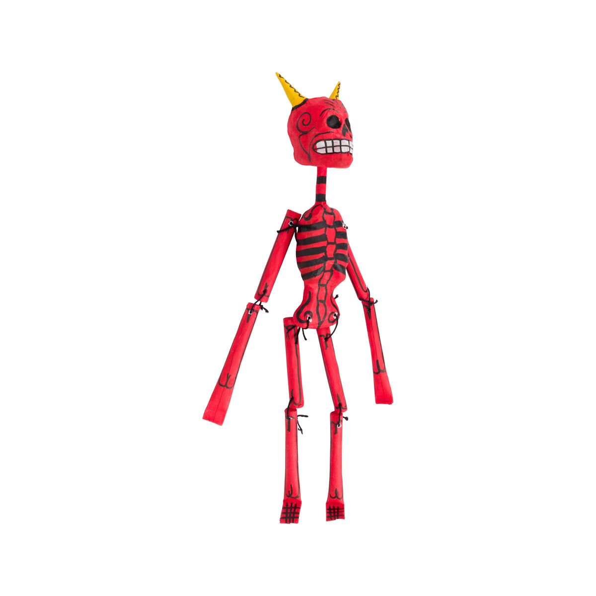 A red and black articulated skeleton doll with yellow horns, standing against a plain white background.