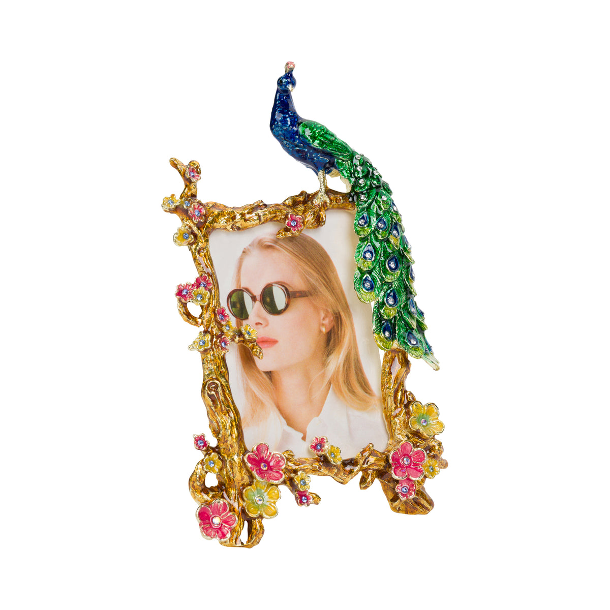 An ornate metal gold tone photo frame with three-dimensional flowers, branches and a peacock.