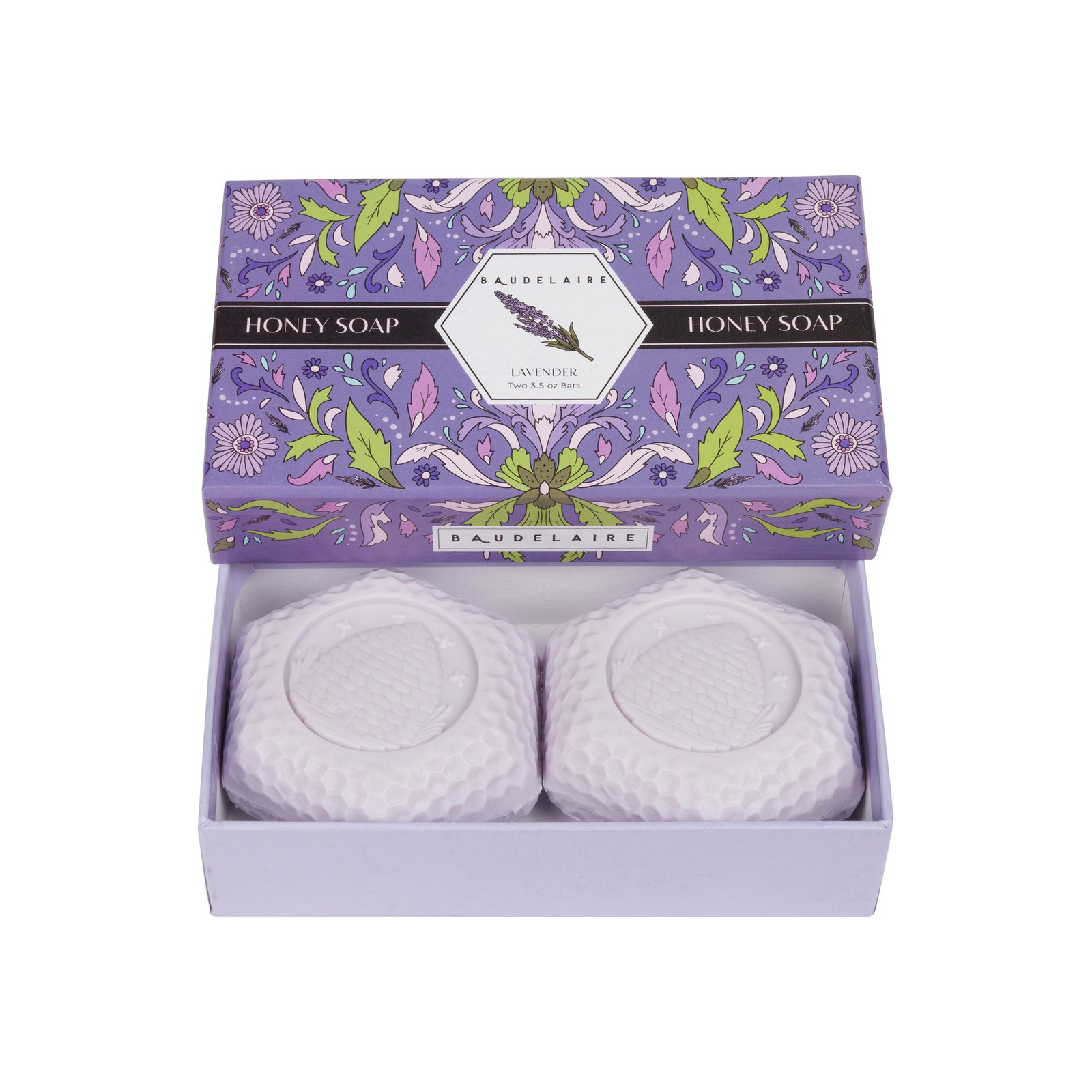 A lavender honey soap gift set by Baudelaire, featuring two round white textured soap bars in a light lavender box with a floral-patterned lid.
