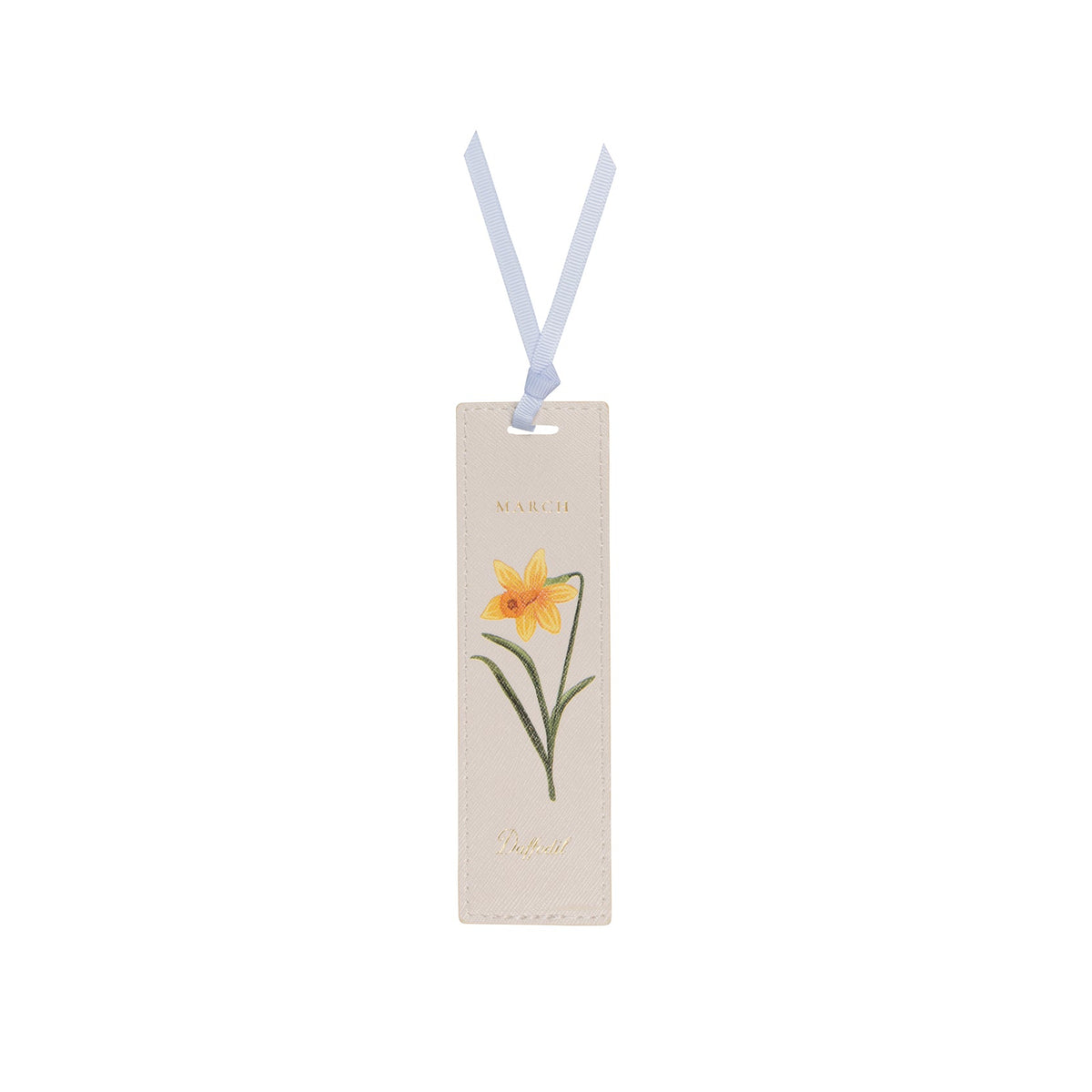 A rectangular cream-colored leather bookmark with a light blue ribbon loop, featuring an illustration of a yellow daffodil with green leaves and stems, and the word 'MARILY' printed above.