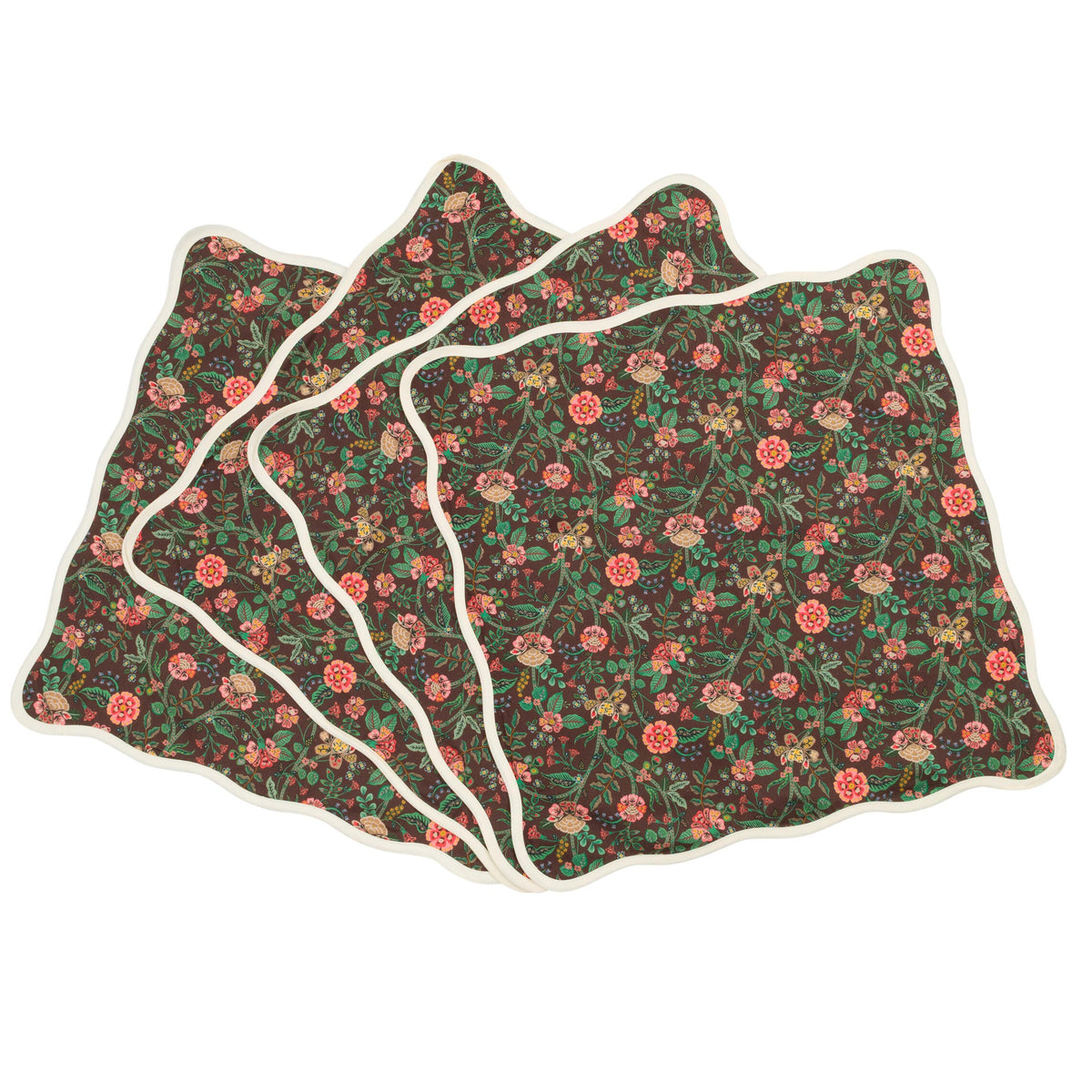 Set of four floral-patterned napkins on a white background