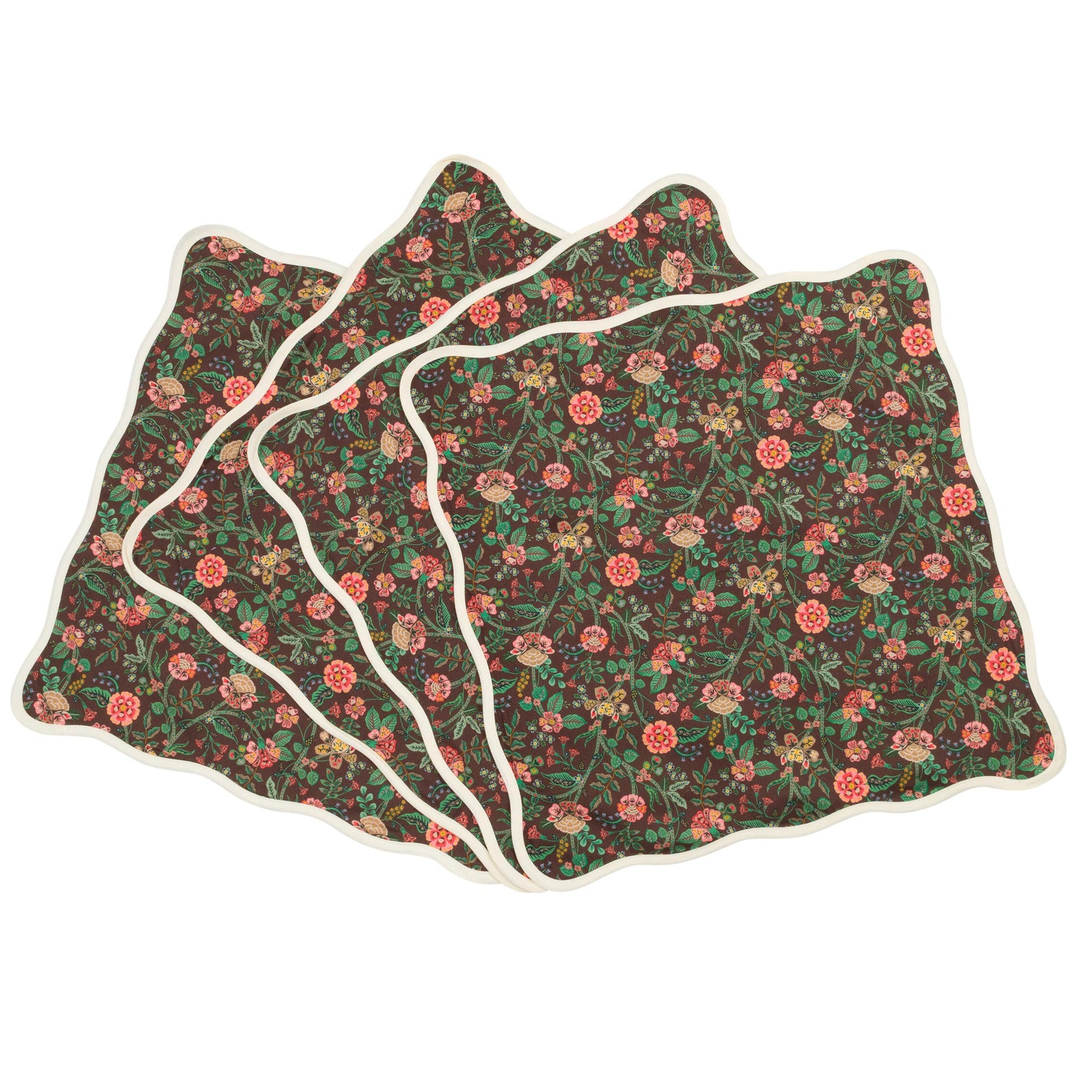 Set of four floral-patterned napkins on a white background