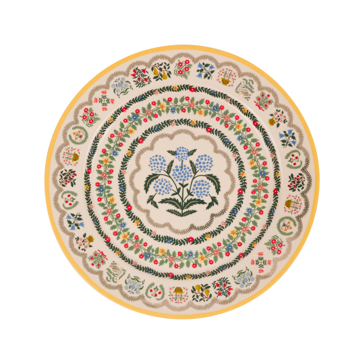 Decorative round plate with floral and botanical design on a white background