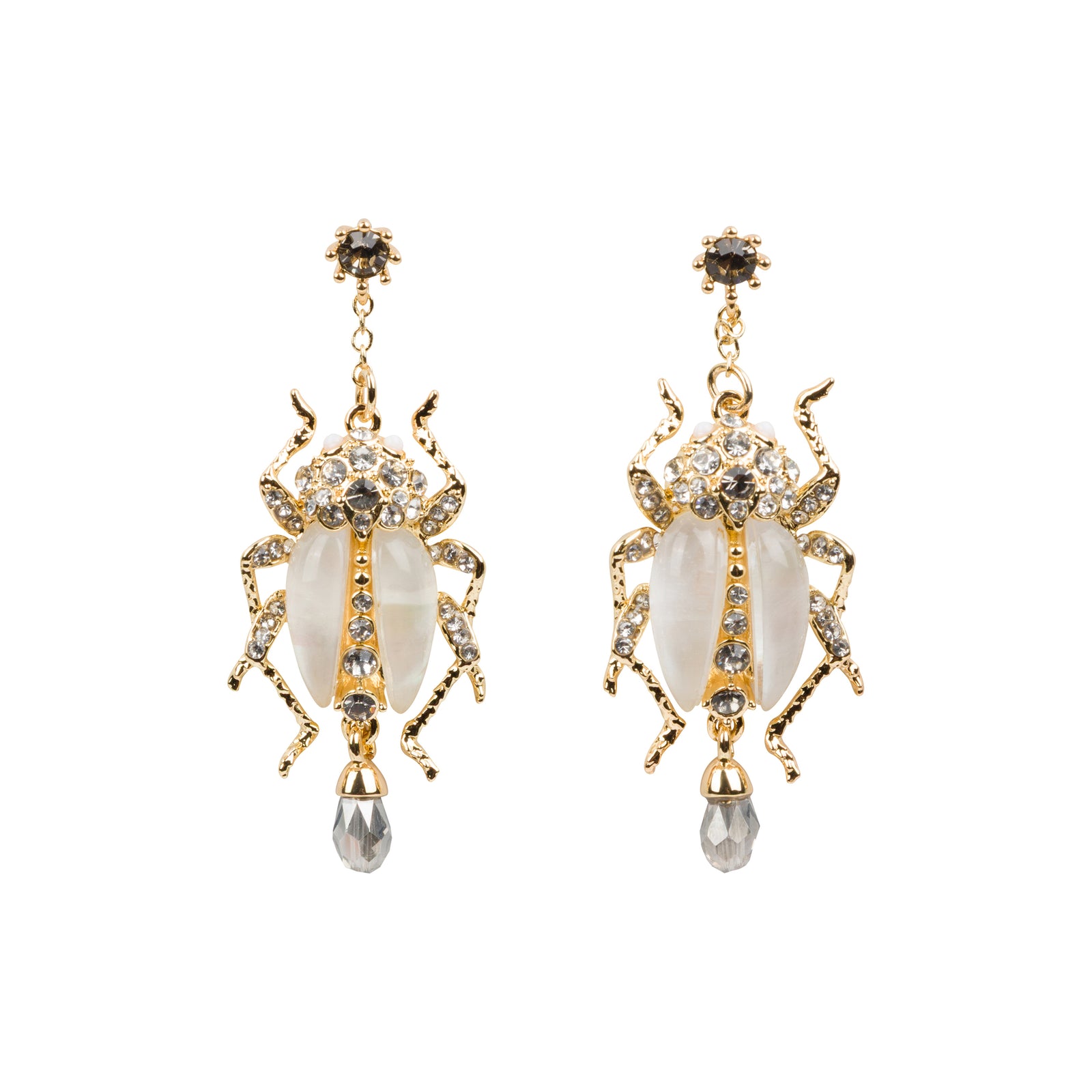 A pair of earrings shaped like large beetles, encrusted with rhinestones and faux pearls on a white background