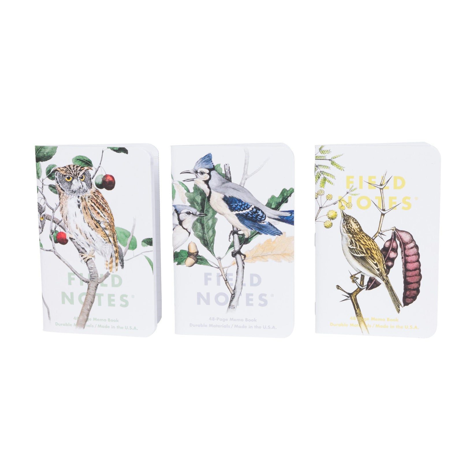 Three pocket-sized notebooks with illustrations of birds on a white background