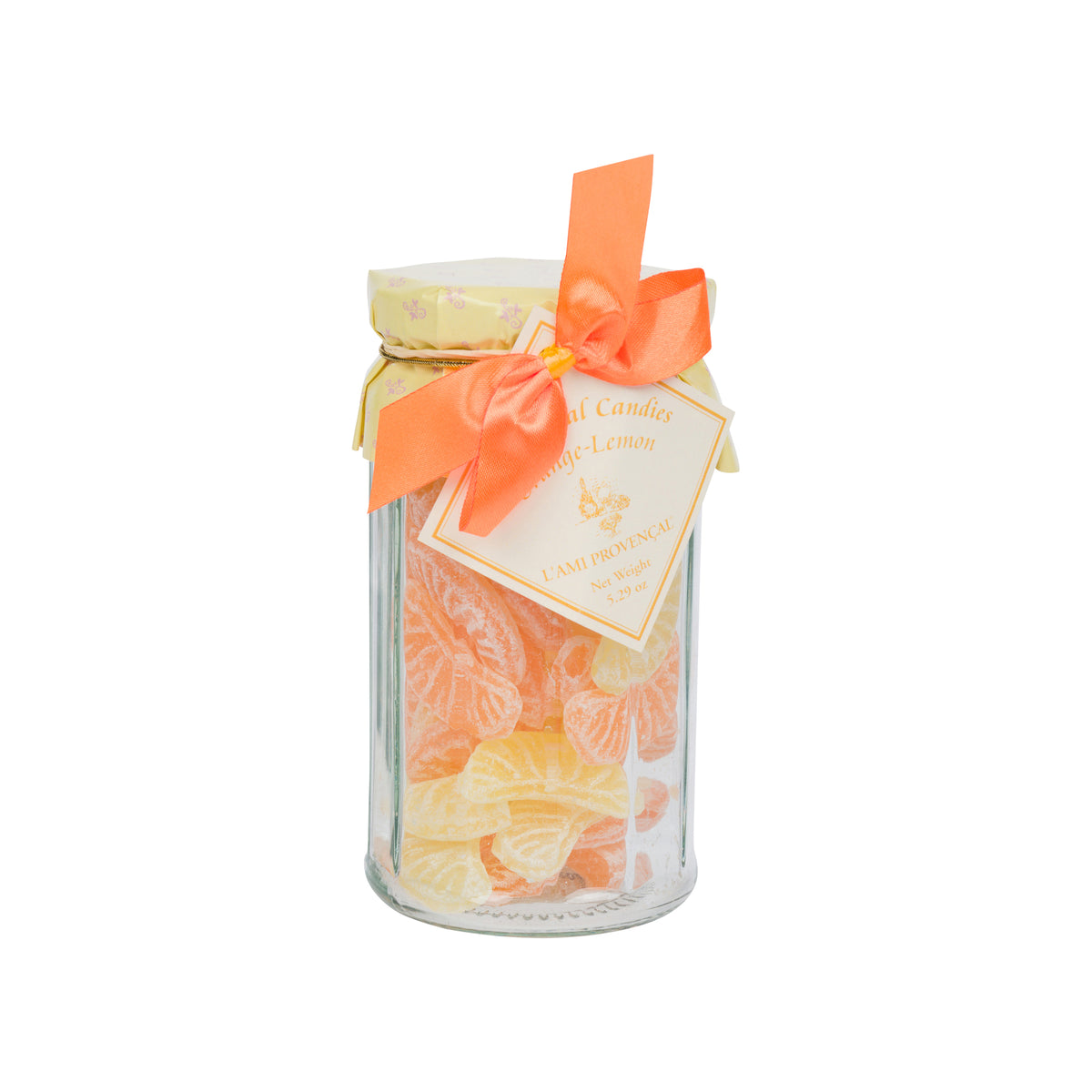 A glass jar filled with orange and yellow citrus-shaped candies, tied with a bright orange ribbon and a hanging tag that reads Cami Profumati Candy Lemon.
