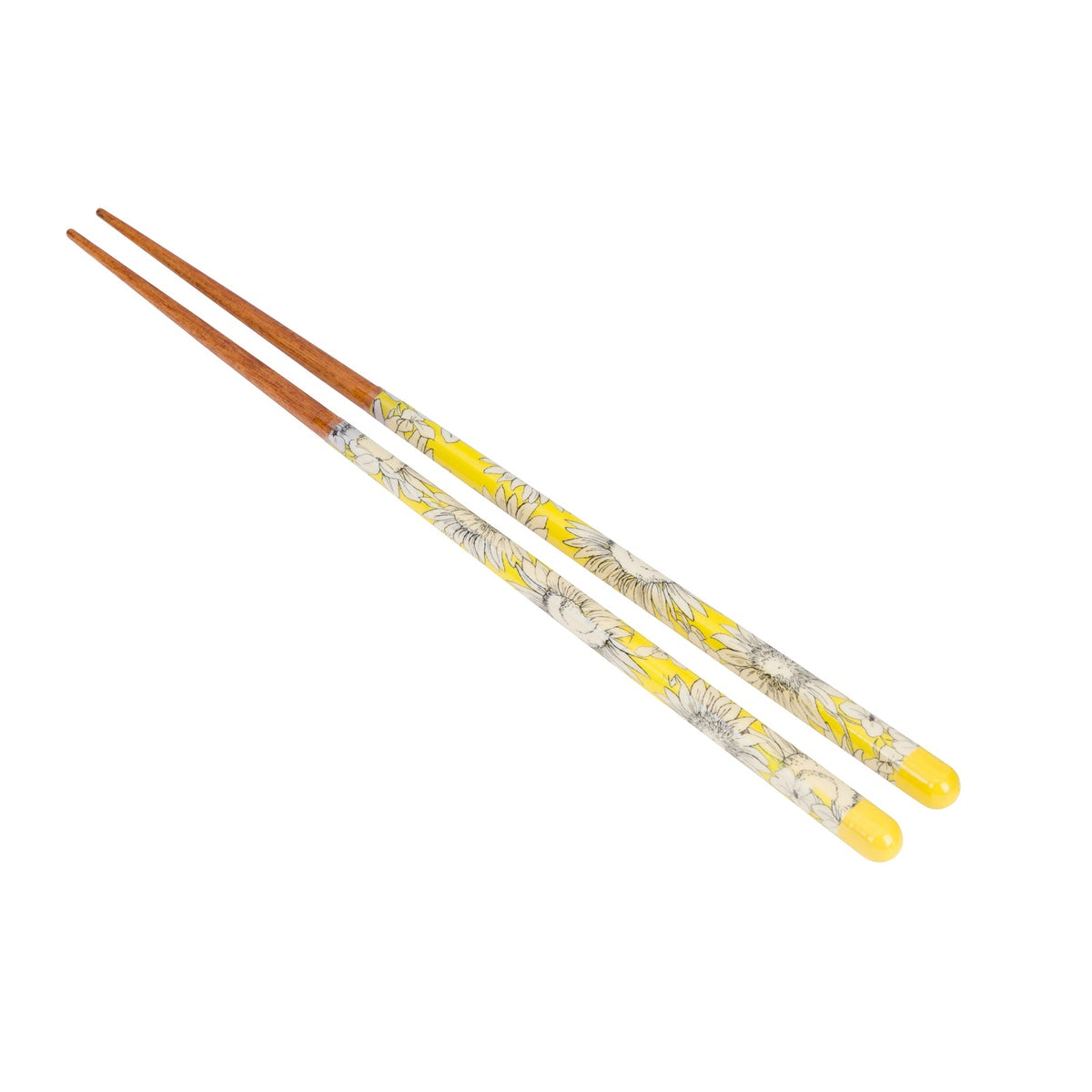 A pair of chopsticks with brown wooden tips and yellow handles decorated with a white floral pattern, shown on a plain white background.