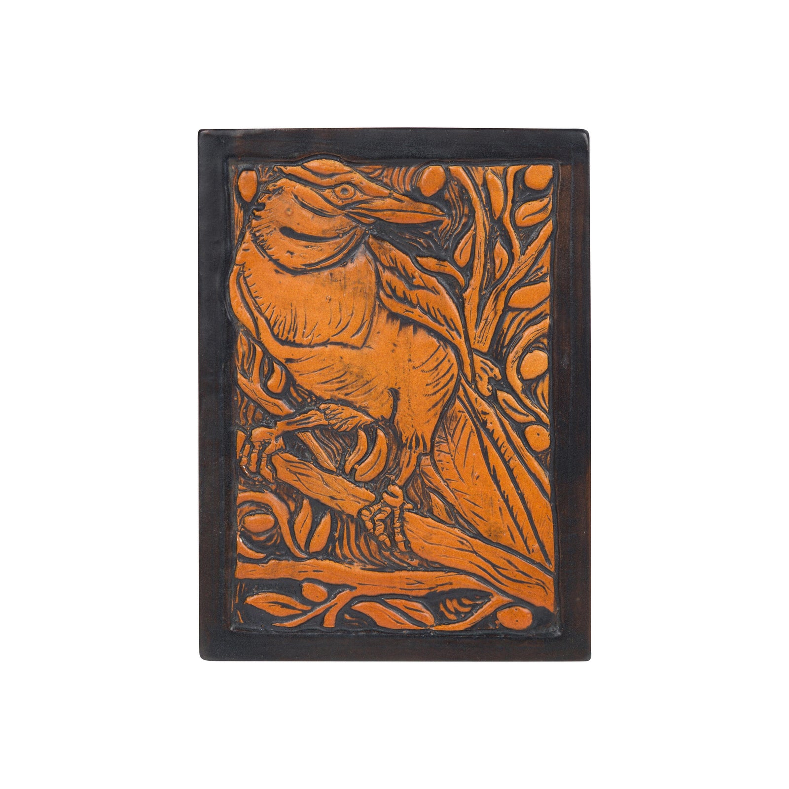 Decorative ceramic tile by Ephrain Faience with a Magpie bird design on a white background