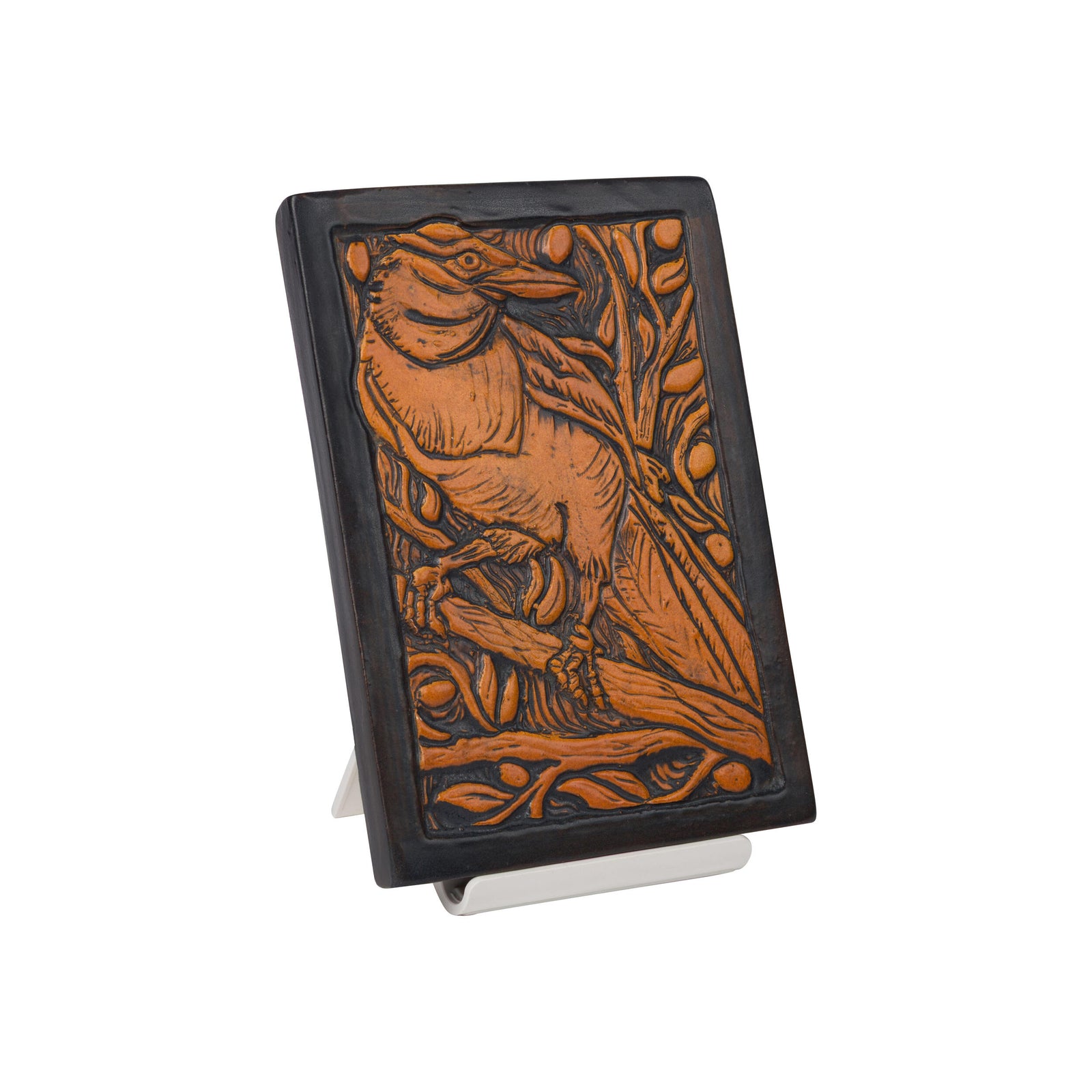 Decorative ceramic tile by Ephrain Faience with a Magpie bird design on a white background