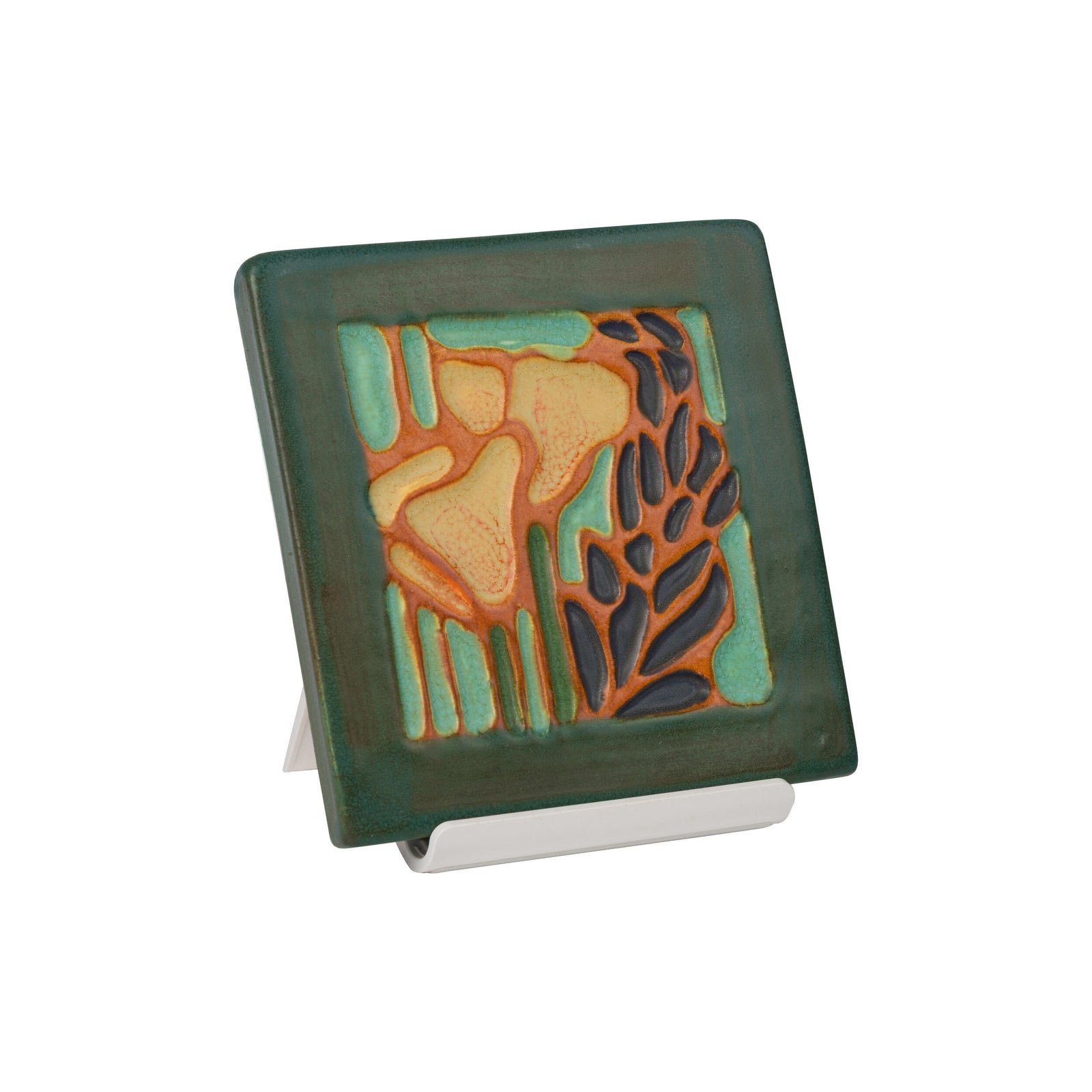 Square ceramic tile with artistic design on a white background