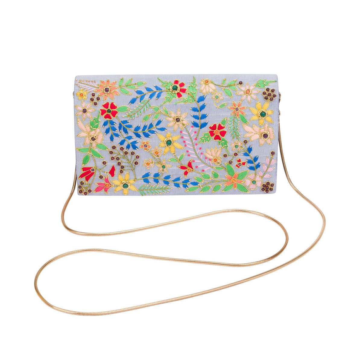 A rectangular crossbody clutch bag with a light blue-gray background and vibrant multicolor floral embroidery, featuring a thin gold-tone chain strap, shown on a plain white background.