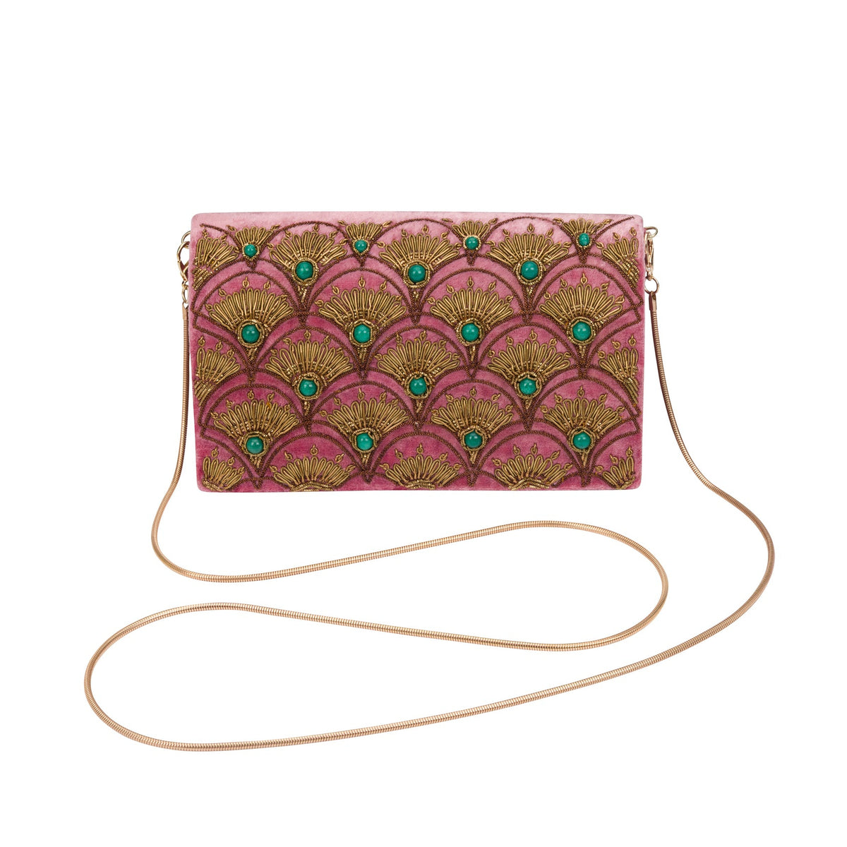 A rectangular clutch bag with a pink background and a repeating gold fan pattern, accented with small green jewel motifs. It features a thin, elegant gold chain strap and is displayed on a clean white background.