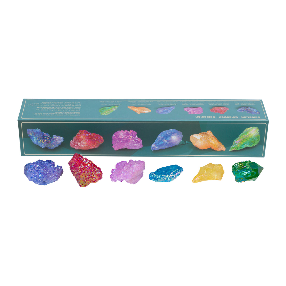 A set of 10 colorful raw crystal stones arranged in a row in front of their teal-green packaging box, which features illustrations of the same crystals. The crystals display a variety of vibrant colors including blue, purple, pink, orange, yellow, and green.