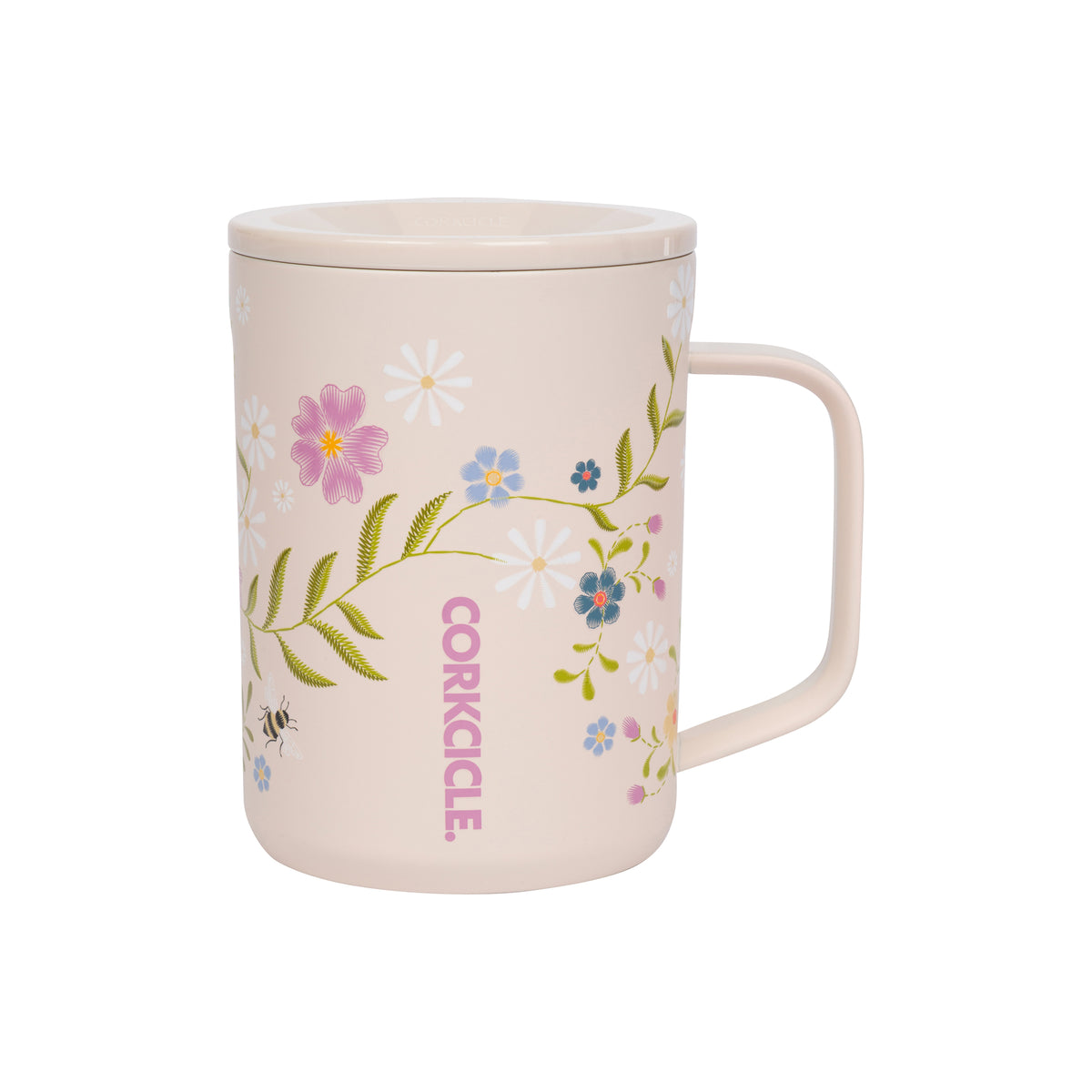 A light pink ceramic mug with a matching lid, decorated with a delicate floral vine pattern in pink, blue, green, and white, featuring the brand name 'CORKCILE' printed vertically in pink.