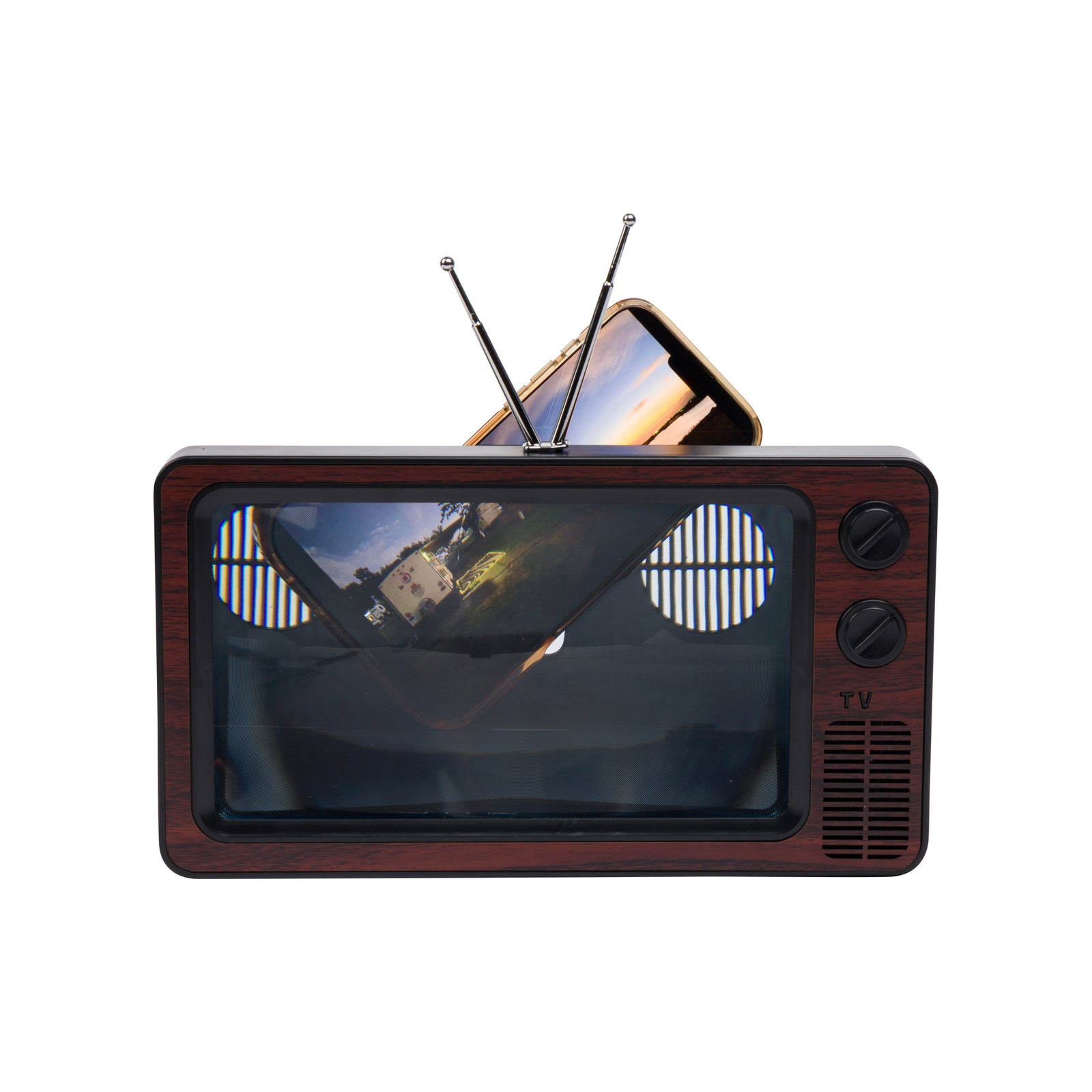 A retro-style vintage television set which magnifies a cellphone with a dark brown wood-grain cabinet, a black screen, two silver antenna rods, and two black control knobs on the right side, isolated on a white background