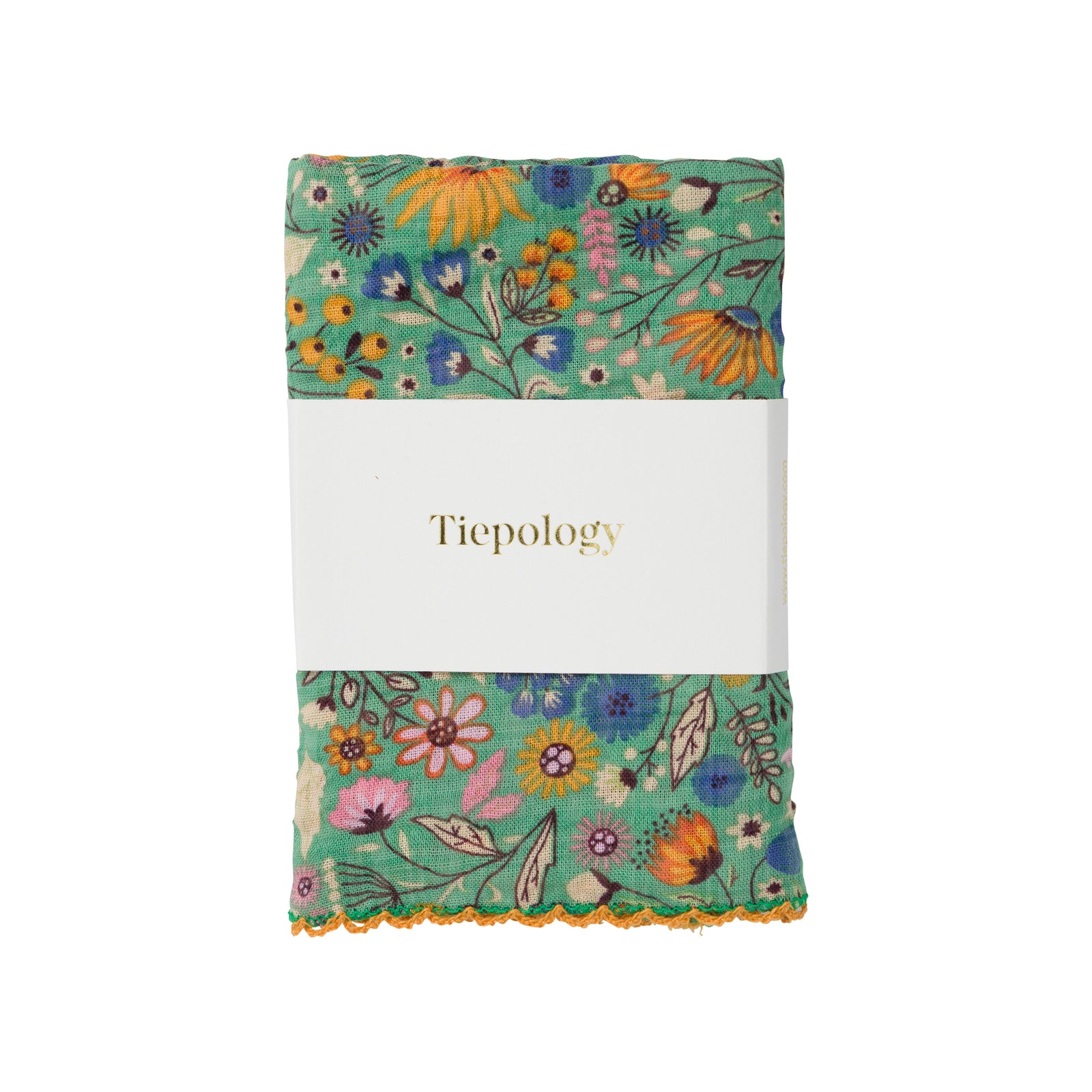 A square fabric bandana scarf featuring an all-over dense floral and botanical pattern in shades of green, blue, purple, orange, and pink on a light cream background.