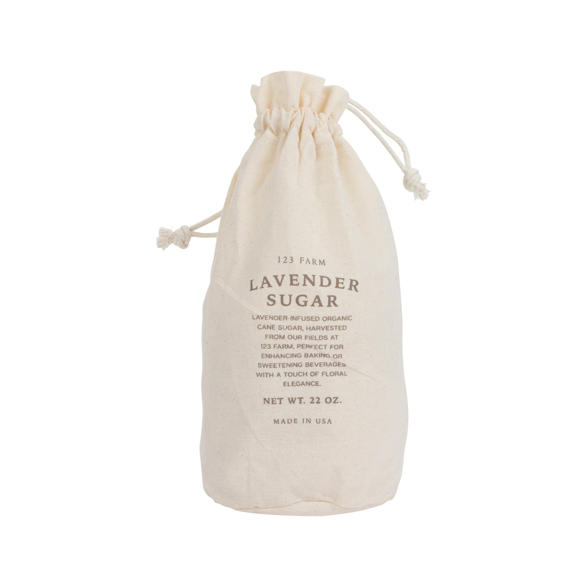 Cotton drawstring bag of lavender sugar on a white background.