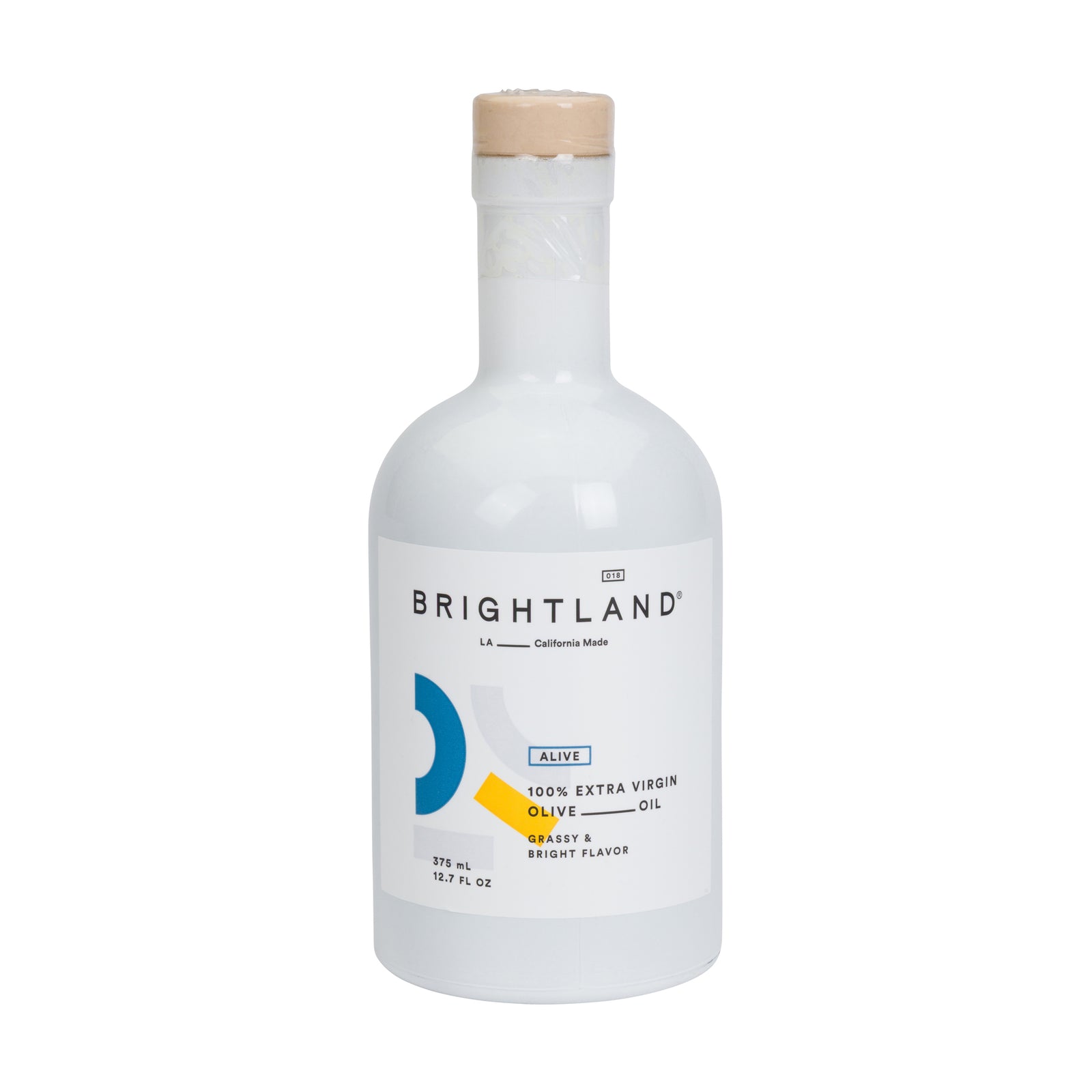 Brightland Alive 100% Extra Virgin Olive Oil in a white glass bottle with a light beige cap, on a solid white background.