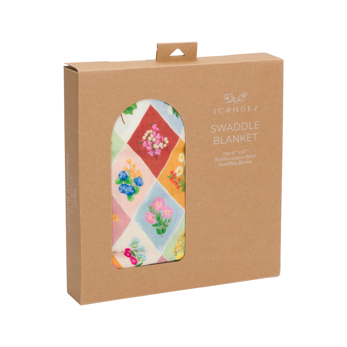 A patterned baby blanket with a floral and harlequin design in a natural brown box on a white background.