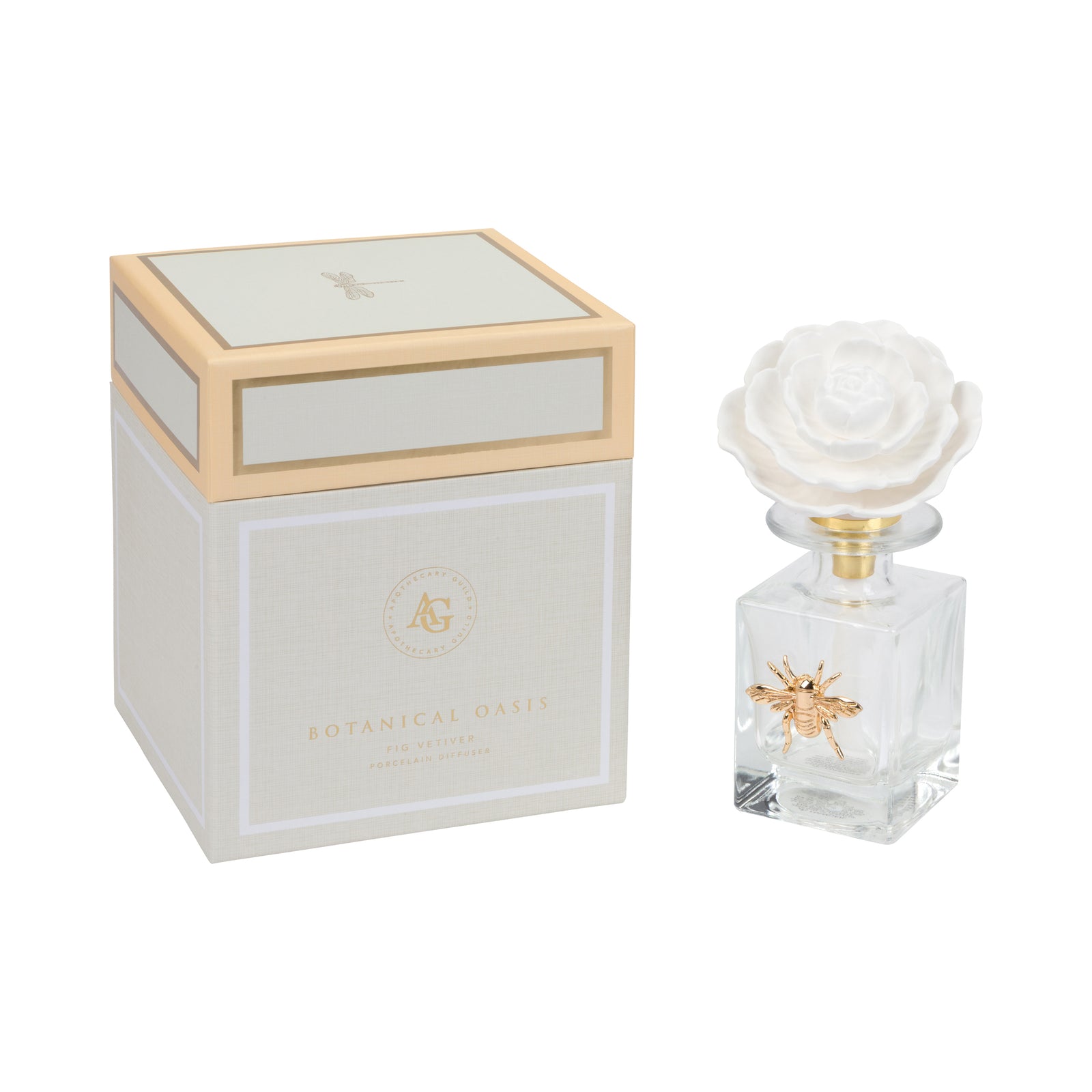 A clear glass diffuser bottle with a white rose-shaped cap and gold bee detail, shown next to its white and gold Botanical Oasis fragrance box on a white background.