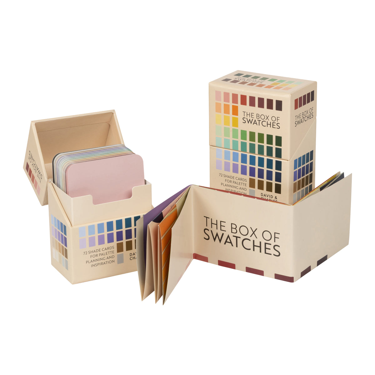 The Box of Swatches by Color & Inspiration, featuring a beige cardboard box with a built-in color grid and multiple sample cards fanned out inside and beside it on a white background.