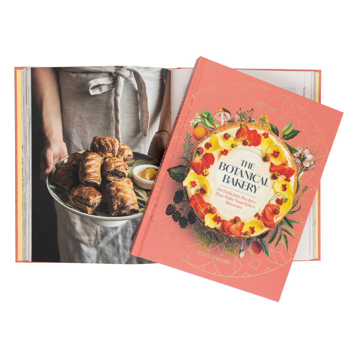 Two books are arranged on a white background: an open cookbook showing a photo of pastries, and a closed copy of "The Botanical Bakery" with a large floral pastry illustration on the cover.