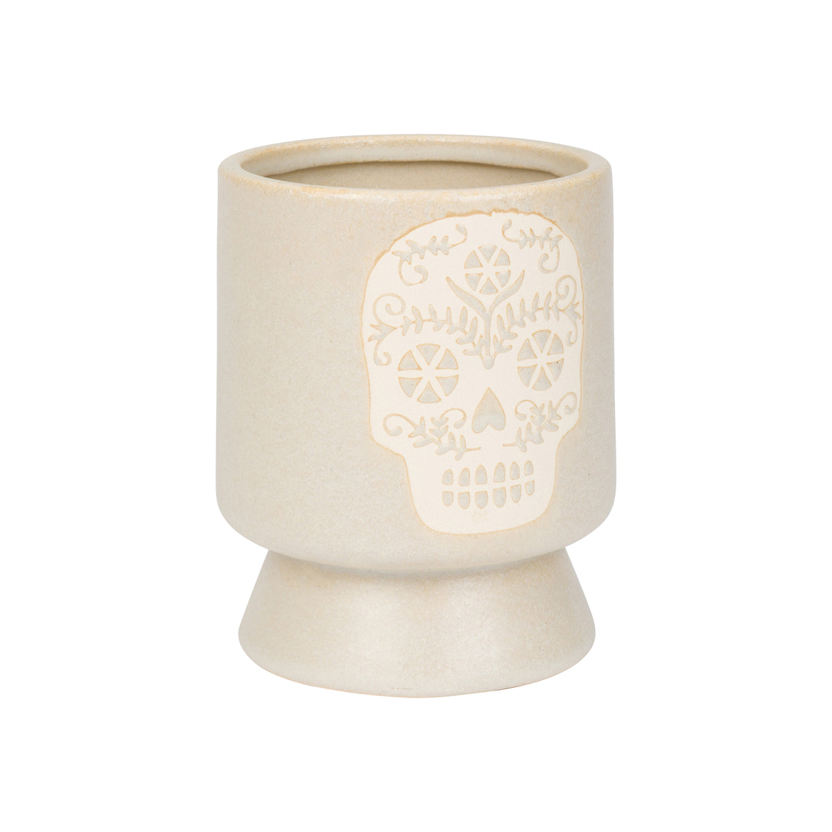 Cream planter with a light colored, embossed sugar skull design on the front, on a white background.