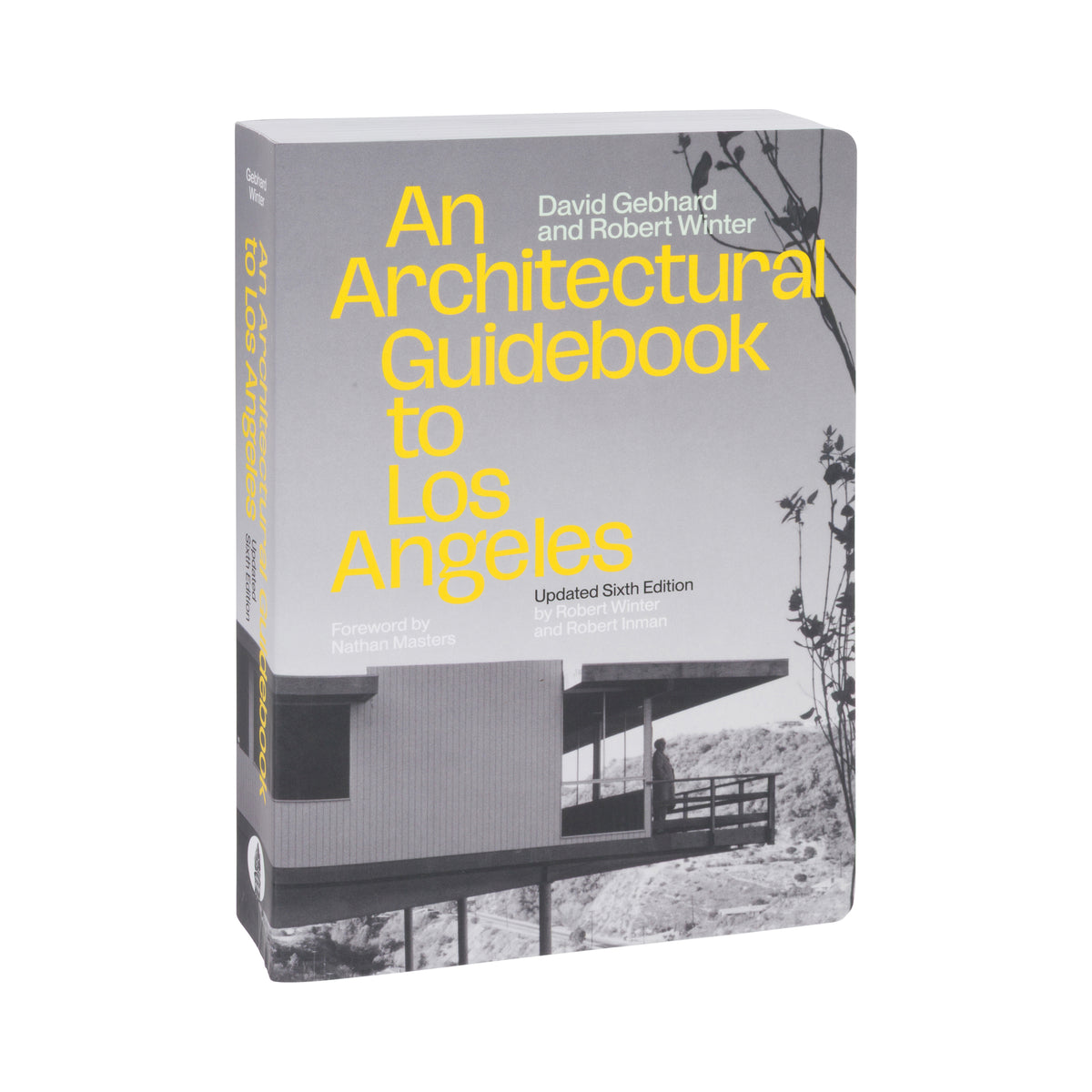 The front cover and spine of the book 'An Architectural Guidebook to Los Angeles' by David Gebhard and Robert Winter, featuring a black and white architectural photograph of a modern house on a hillside with bold yellow title text, shown on a plain white background.