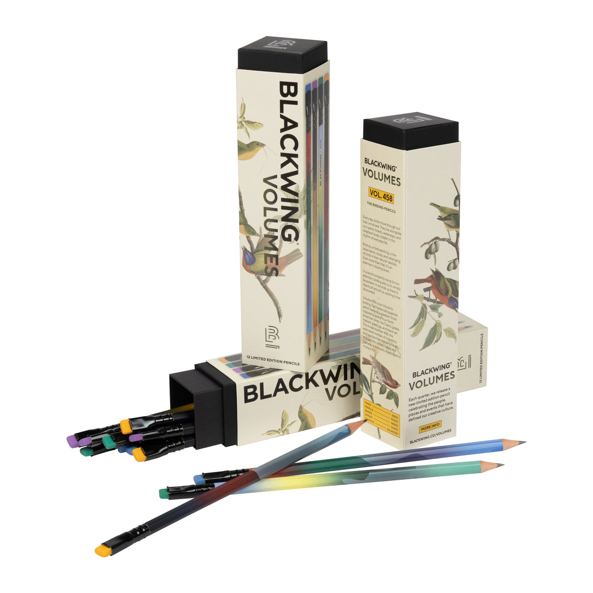 Blackwing Volumes colored pencils and their illustrated packaging boxes on a clean white background. The set includes several pencils with black barrels and colorful tips, alongside tall cream-colored boxes featuring bird illustrations and the text 'BLACKWING VOLUMES'.