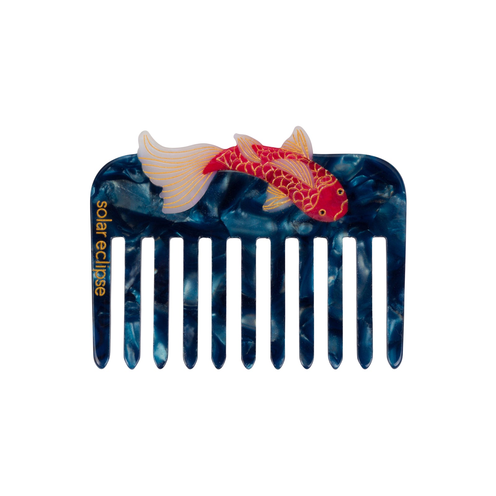 Dark blue marbled comb with an orange and white koi fish motif on a white background.