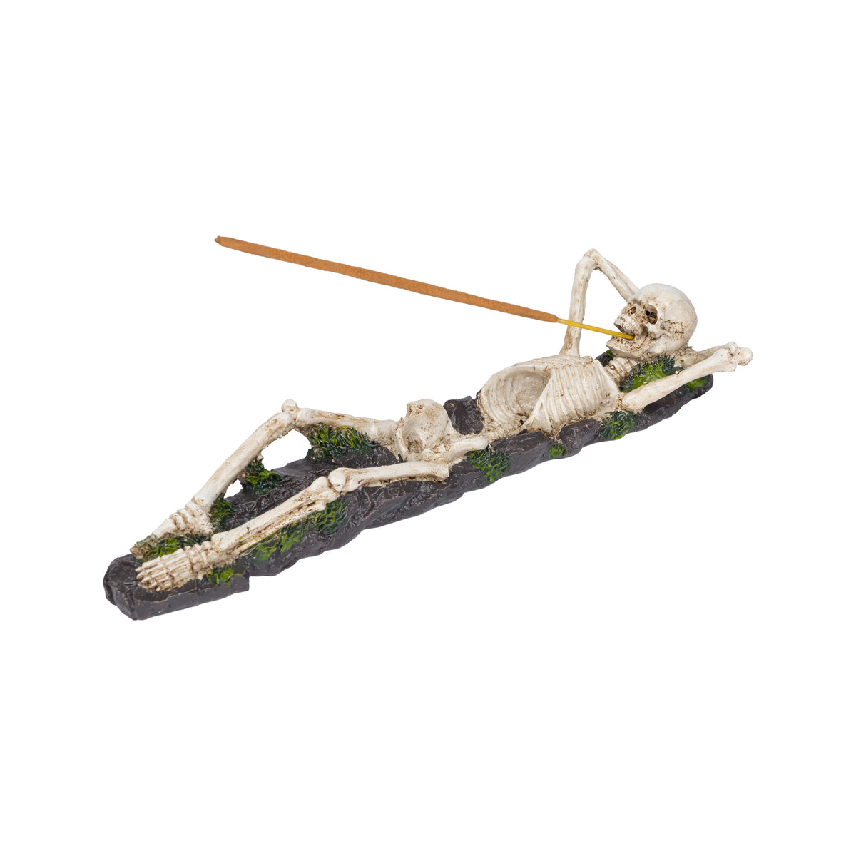 A decorative skeleton incense figurine reclining on a rocky base with green moss details, holding an incense stick, shown on a plain white background.