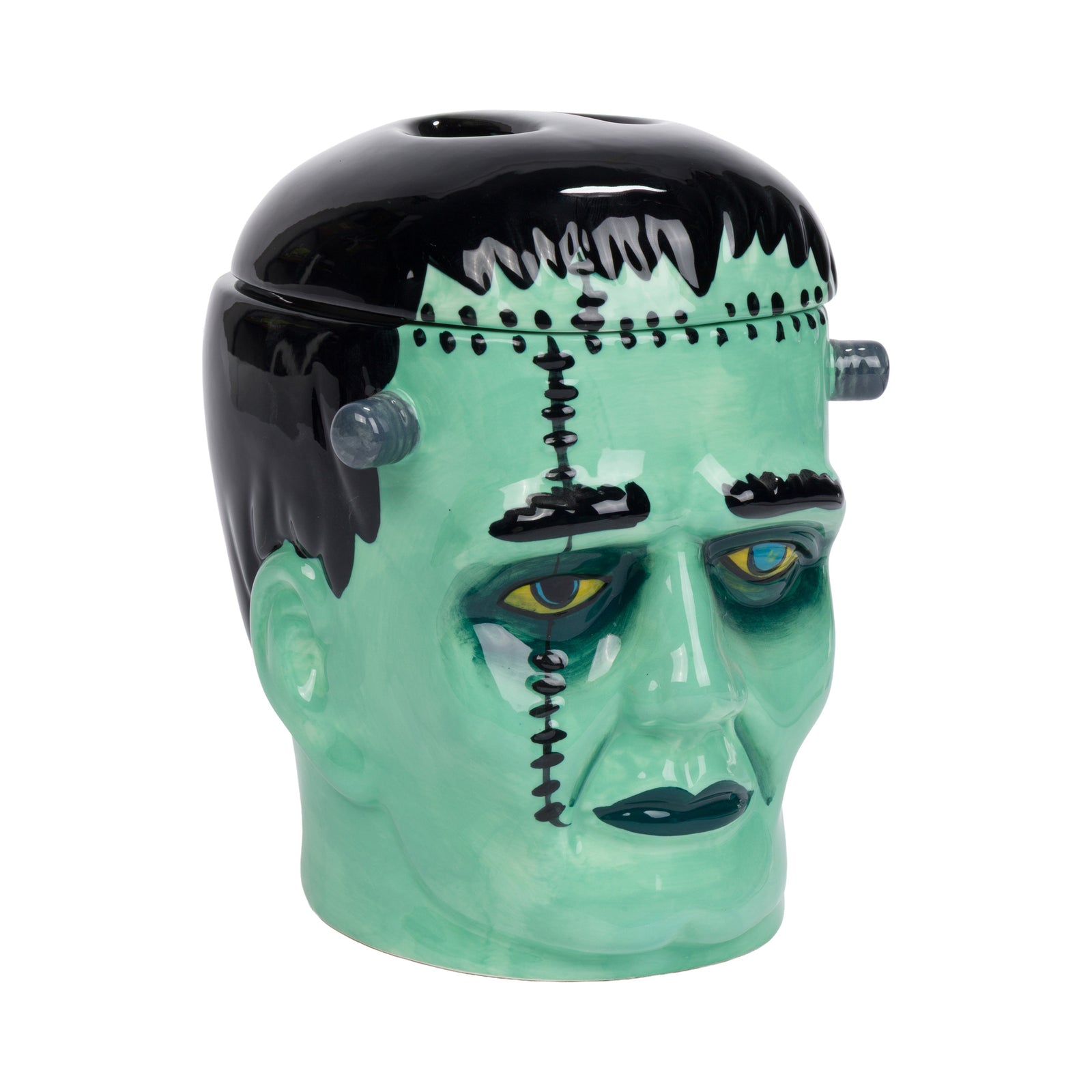 A ceramic Frankenstein's monster head cookie jar with a glossy mint green face, black hair, and stitched details, set against a plain white background.