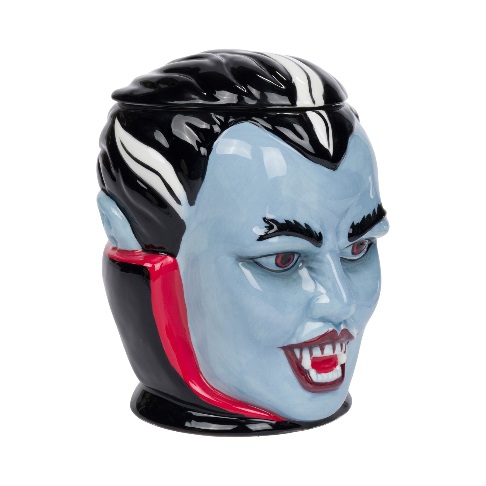 A ceramic vampire face cookie jar. The jar features a glossy light blue face, black hair, red collar accents, and red vampire fangs, set against a plain white background.