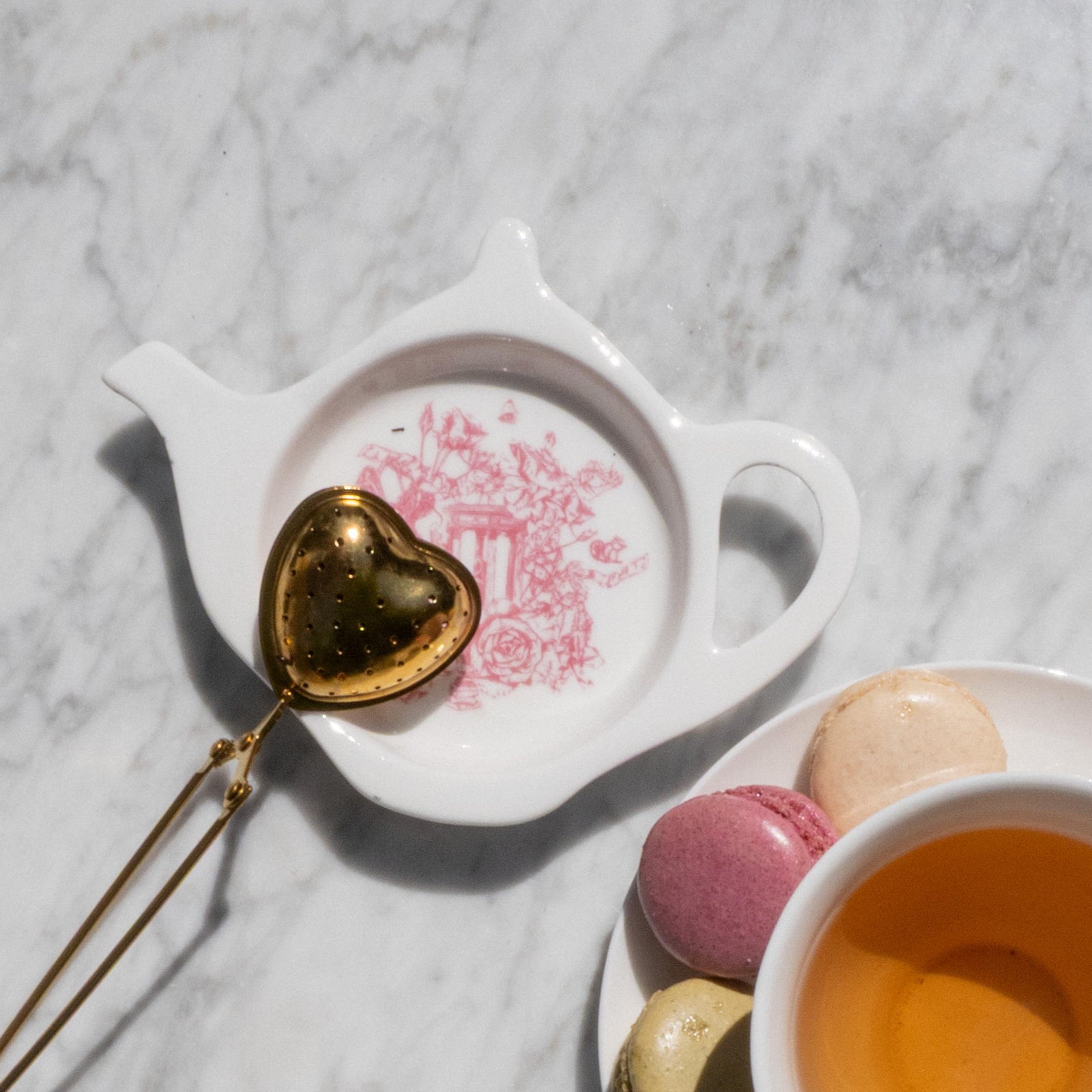 AVAILABLE SOON This delightful tea trivet is the prettiest catch-all for your teabags, teaspoons, tea leaves, and more! It features an excerpt from our exclusive Rose Garden toile print