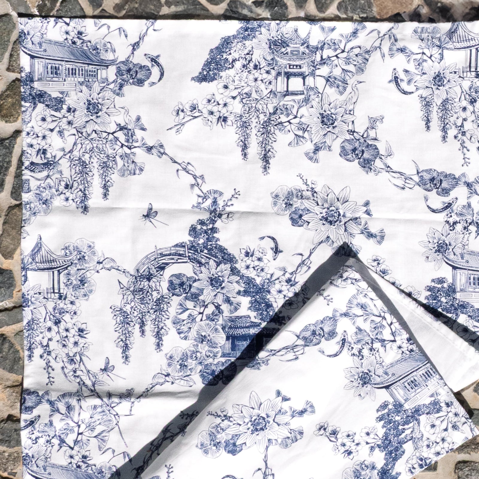 This delightful cotton tea towel features our exclusive Asian Gardens toile print. Originally a French design style, 'Toile de Jouy' prints featured intricate, repeating patterns of scenes or vignettes depicting pastoral or historical themes. Look closely at our toile, and you will notice recognizable Huntington details