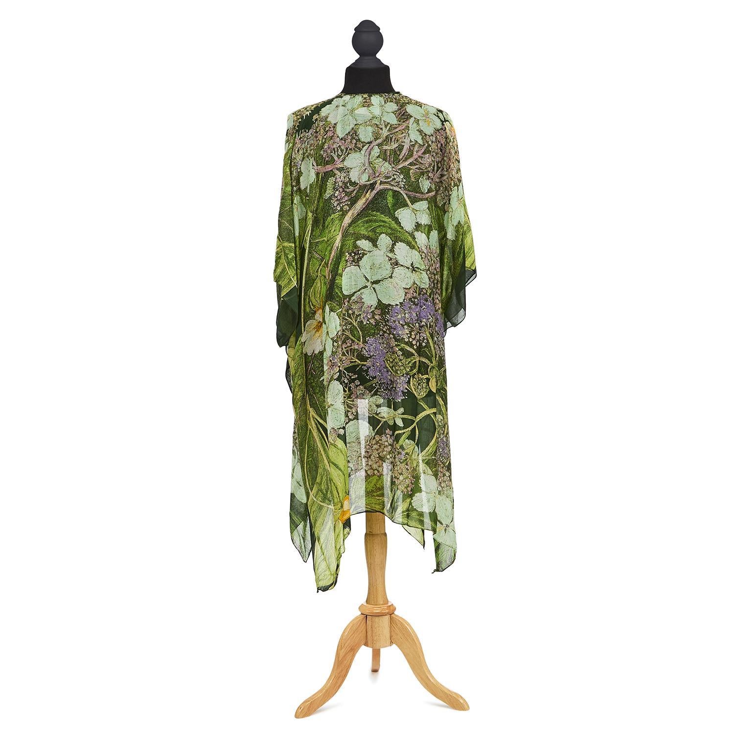 This striking Hydrangea print kimono takes inspiration from Marianne North's archive of paintings and samples, which is held by the Royal Botanical Gardens at Kew, England. This lightweight throwover makes the perfect cover up. One Size: Collar to hem, 40" Width, 74". 50% Modal 50% Viscose Hand wash at 30ºc.