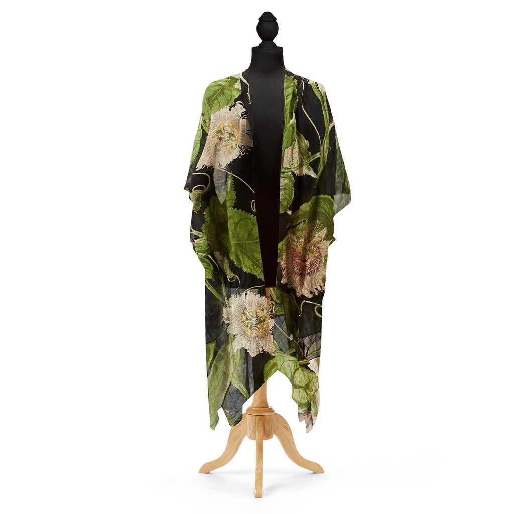 The perfect summer cover up! This long kimono has a beautifully gauzy feel and is lightweight enough to fold up and pop in your purse, but also heavy enough to keep the chill off when the sun goes down. Features a beautiful historical sketch of passion flowers on a black base. 50% modal and 50% viscose. One size.