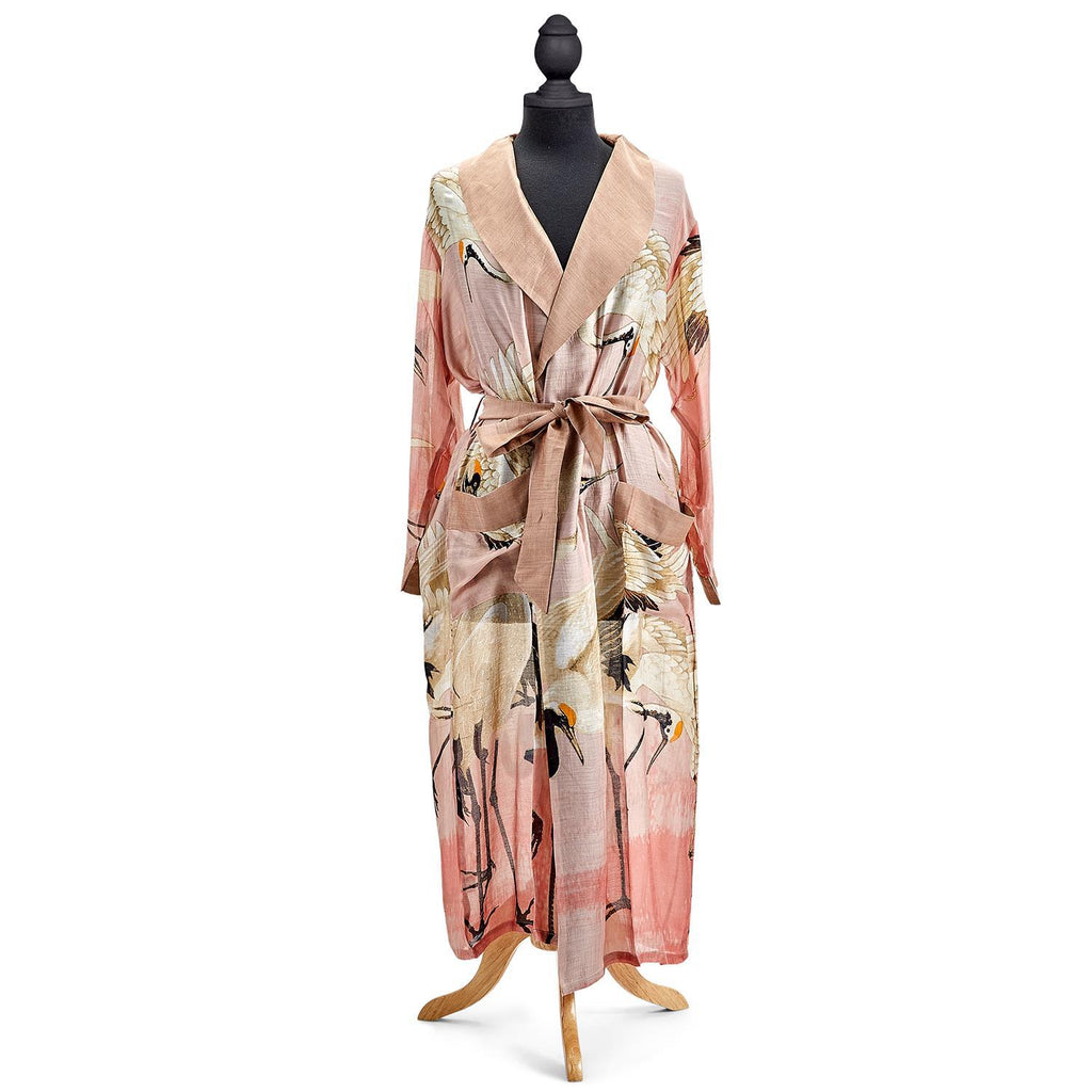 This soft, lightweight gown is cut to a long length for an elegant look and features a self-tie waist belt for a flattering fit. The gown is complete with a fold over collar, two patch pockets at the front and a distinctive all-over vintage style Heron print on a pretty pink base. 50% modal, 50% viscose. ONE SIZE.