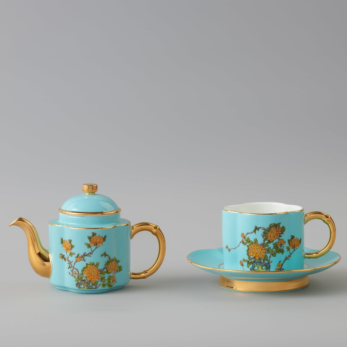 Inspired by the beautiful landscape of West Lake in Hangzhou, China, this stunning tea-for-one set is made from highly refined, premium, chip-resistant porcelain. It is decorated with traditional Peony blooms on an azure-blue base, accented with luxurious gold metallic. This set contains a teapot, sized perfectly for one, a teacup and petal-shaped saucer. 