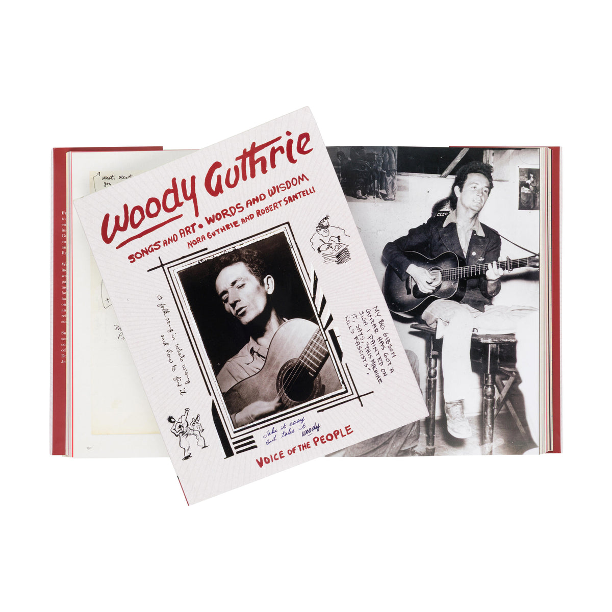 Book with Woody Guthrie's image and text, featuring a black and white photo of a man playing guitar.
