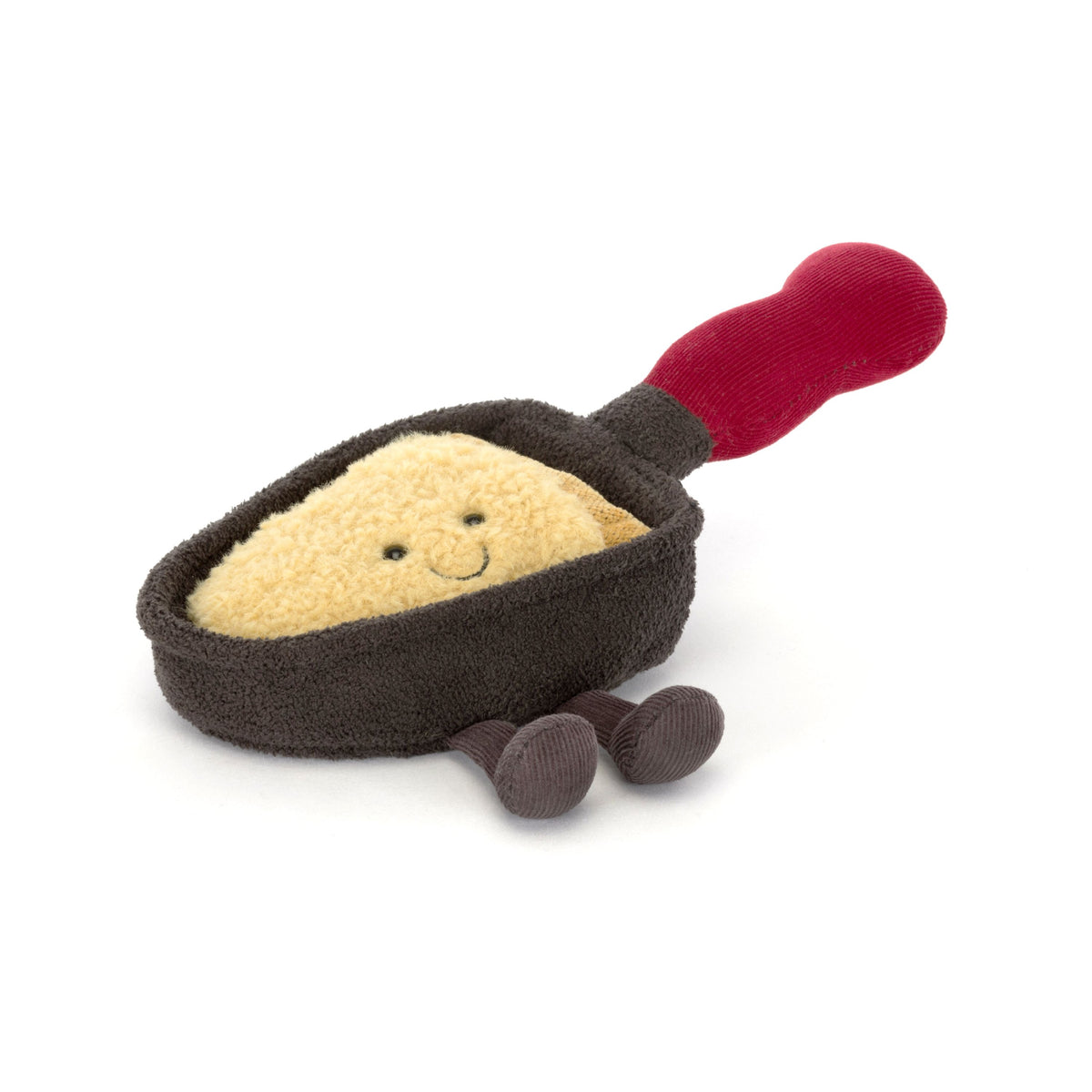 Jellycat plush toy resembling a grilled cheese raclette pan with a red handle on a white background