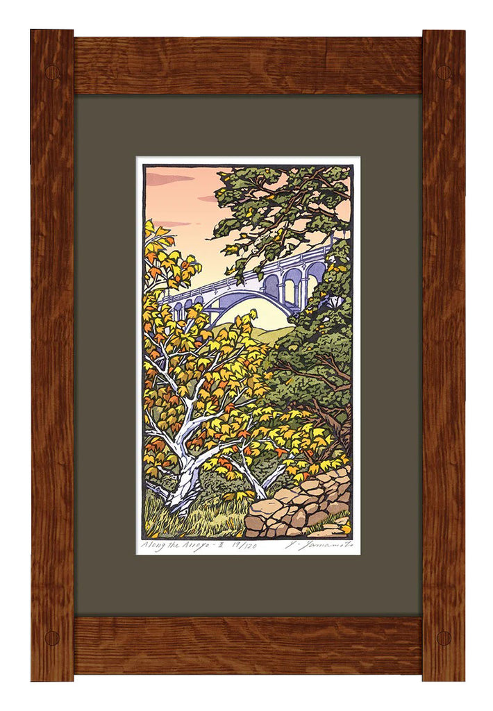 This stunning woodblock print was created by artist Yoshiko Yamamoto. Born and raised in Tokyo, Japan, Yamamoto and her husband have studios in both the US and Kamakura, Japan. Here, she depicts the picturesque Arroyo Seco, Pasadena, CA. Limited edition of 120. Hand finished quartersawn oak frame. 22" x 14.25".