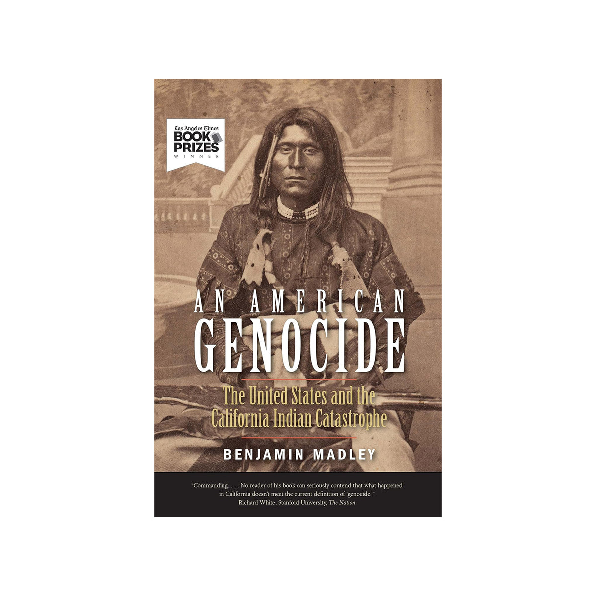 Book cover of 'An American Genocide' with a historical photograph of an Indigenous person on a white background.
