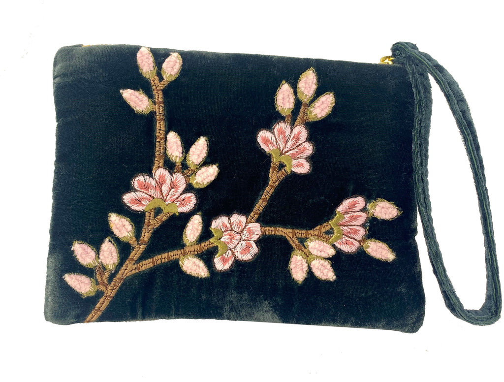 This luxurious deep emerald silk velvet zipper purse is adorned with intricate cherry blossom embroidery. It has a generously sized 'wristlet' loop on the zipper for easy and comfortable carrying. Small enough to use as a chic evening purse, large enough to fit all of your essentials. Dimensions: 6" x 8".