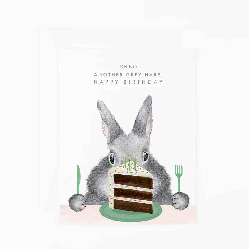 Look out. Those grey hares like to sneak up on you...and your cake. Help a loved one celebrate their special day with this cute and fun Birthday Card. Dimensions: 4 ¼&quot; x 5 ½&quot; Printed on soft white paper and paired with a matching soft white envelope. Blank interior for personal message. Made in the USA.