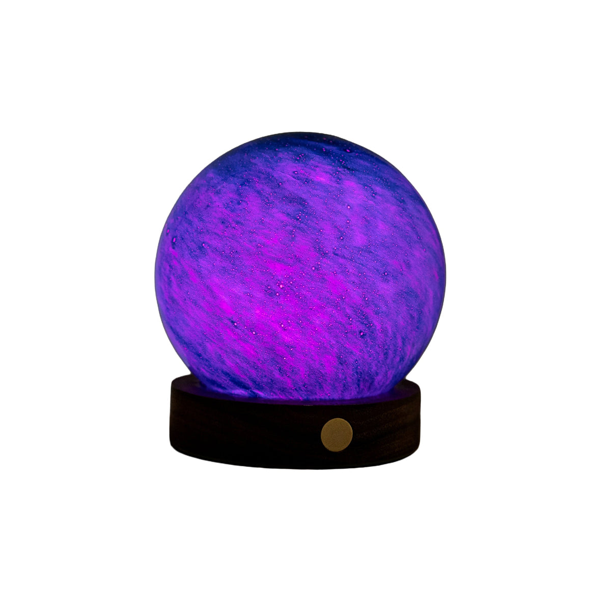 A glowing crystal ball night light with a purple and blue marbled pattern, resting on a dark wooden base with a small gold button, isolated on a white background.