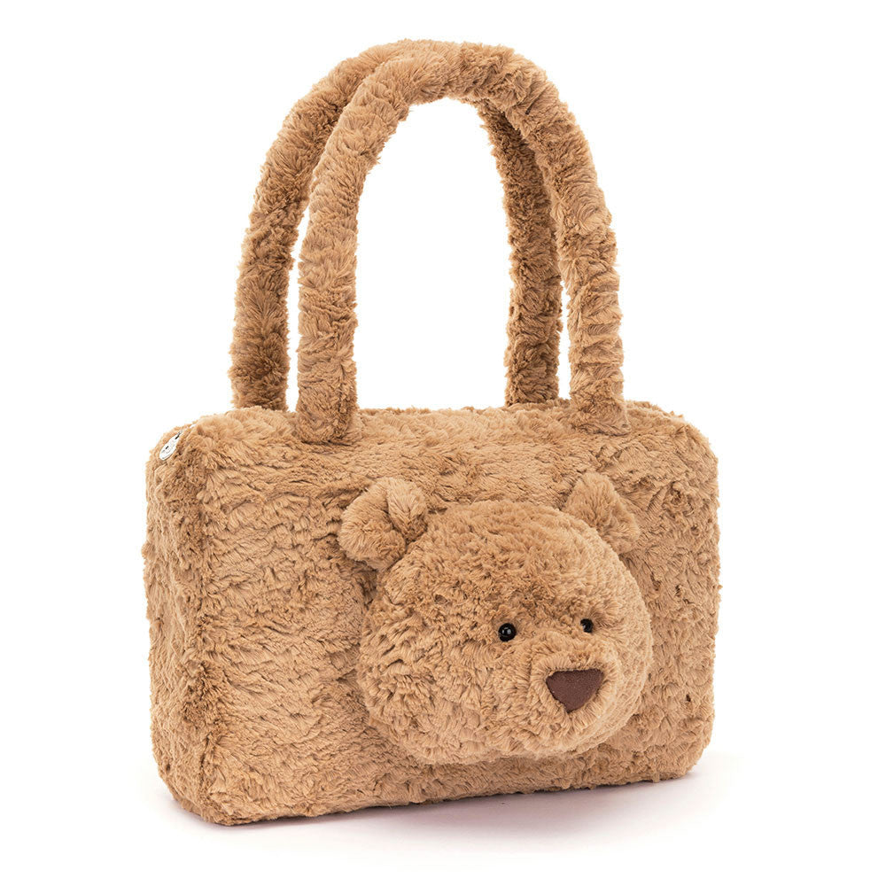 Sometimes it takes Bartholomew Bear Tote Bag to bear the load. This strong, cozy bag has soft fur handles, a cotton lining and a silver zipper. Best of all, it features Bartholomew Bear’s chunky muzzle, fuzzy round ears and suedette nose. Size: 9.4" x 14.2" x 3.1". This item is not a toy, Suitable for 36+.