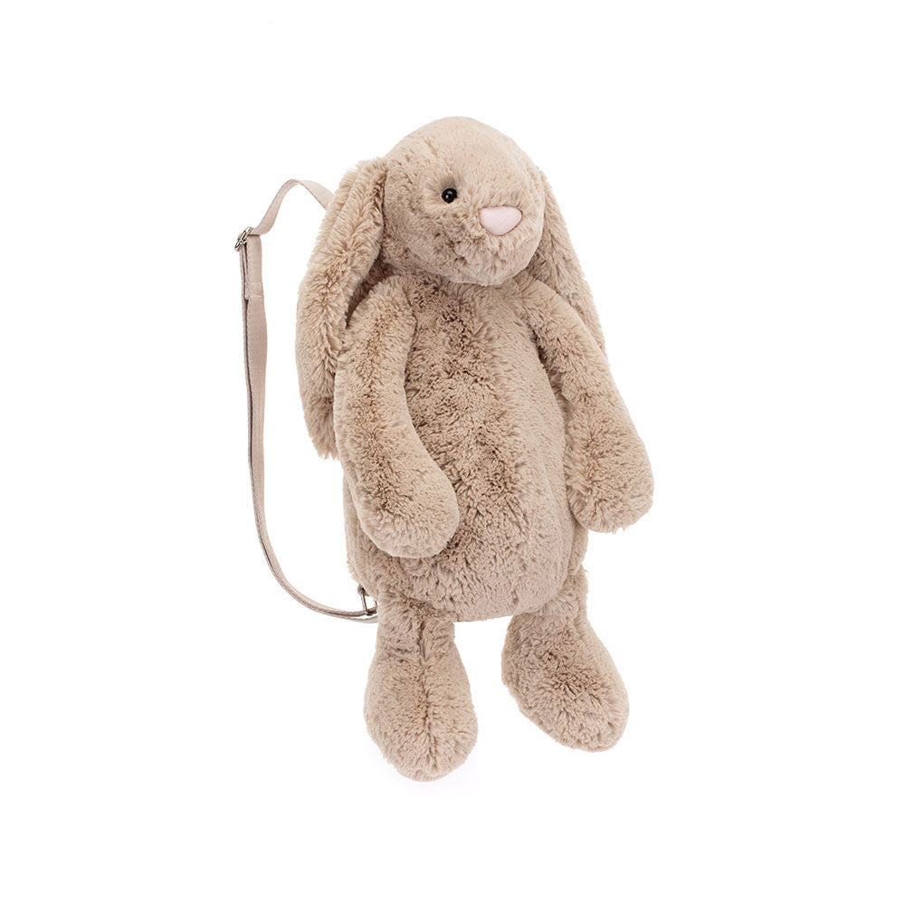 Bashful Beige Bunny Backpack is as useful as she is iconic! In soft beige fur, Bashful Bunny keeps your essentials safe in her tummy with a zip closure with Jellycat logo disc. With wide, adjustable straps in a matching beige, Bashful Beige Bunny Backpack is the perfect companion for everyone